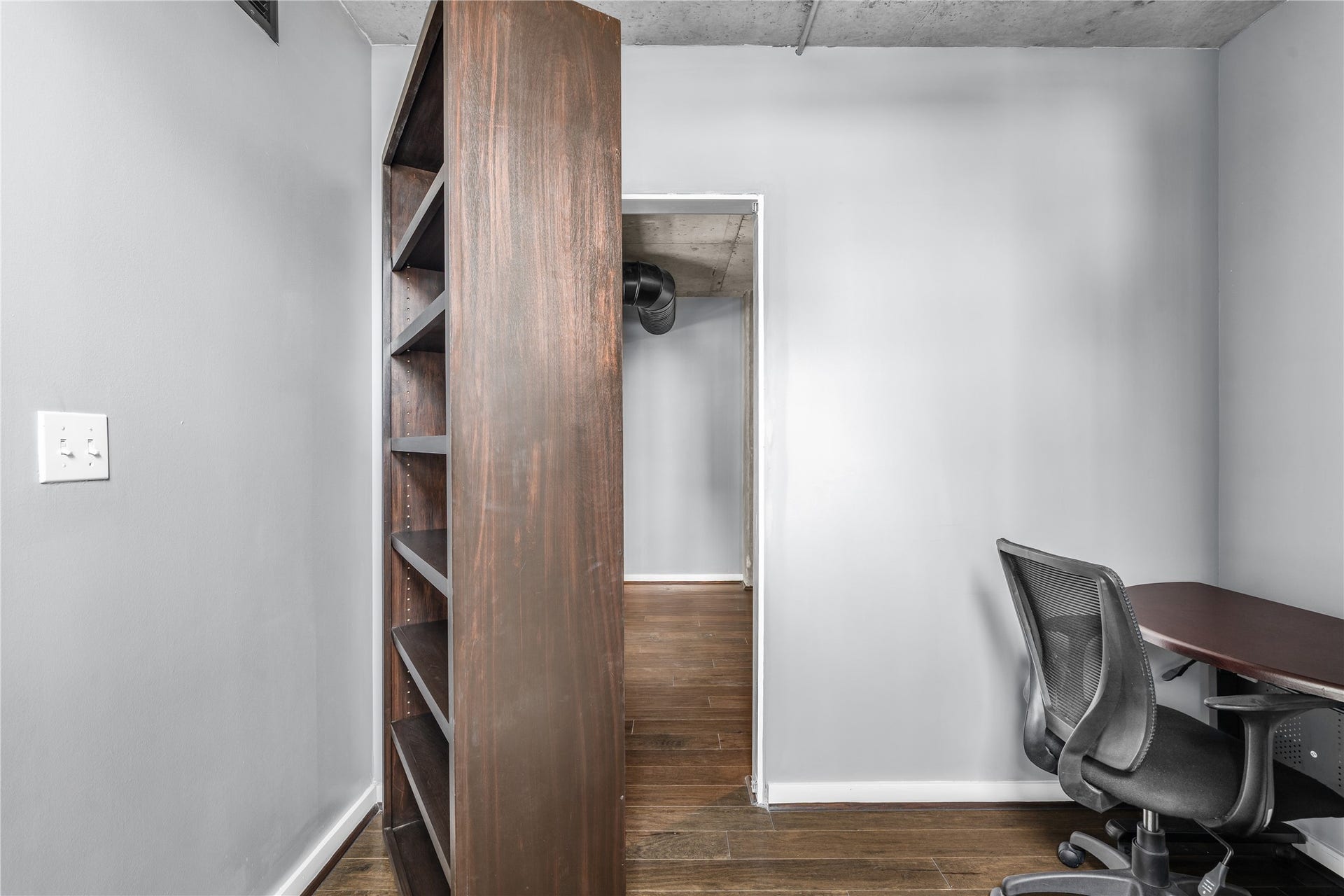 A secret entrance that leads to the secondary bedroom from office loft.