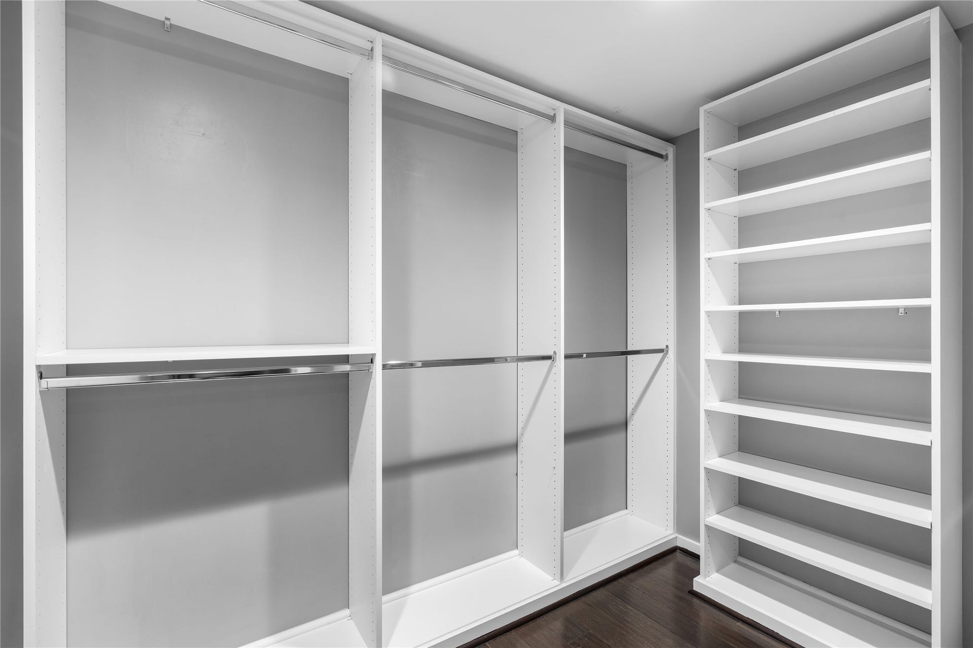 The spacious primary closet offers extensive built in storage and custom organization, creating a streamlined and functional extension of the remodeled primary suite.