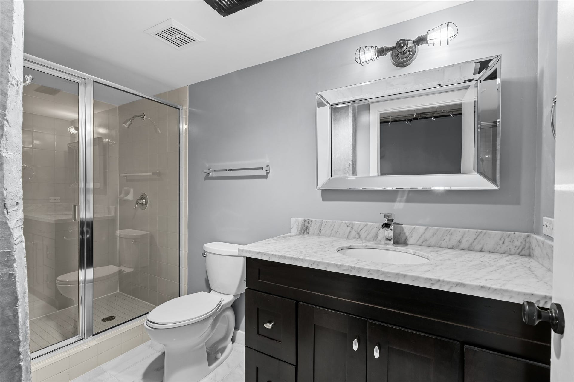 This secondary full bath comes with timeless updates.
