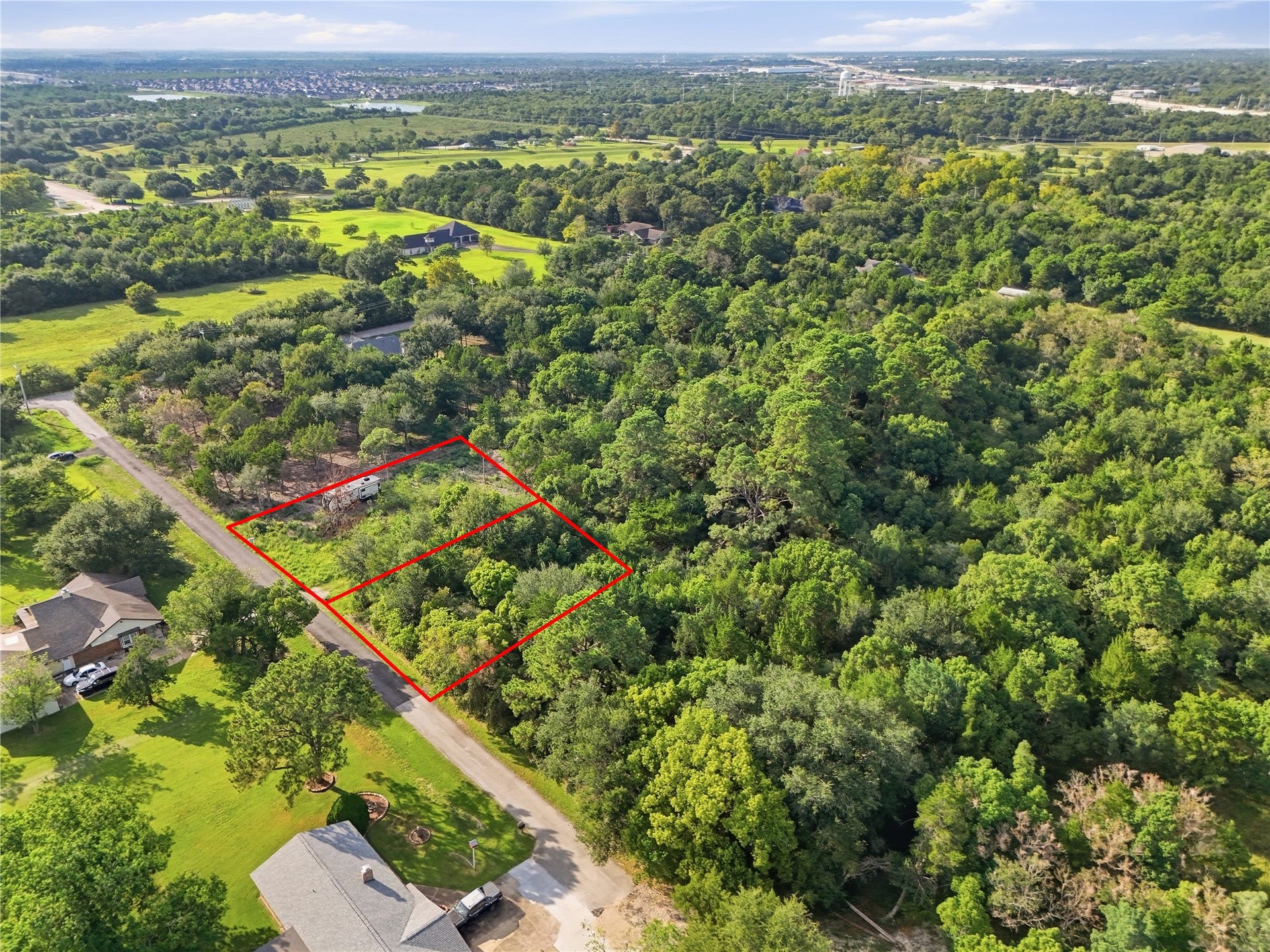 Lot 12 & 13 Moss St, La Marque, TX 77568 Spacious property with a mix of cleared and wooded areas to work with.