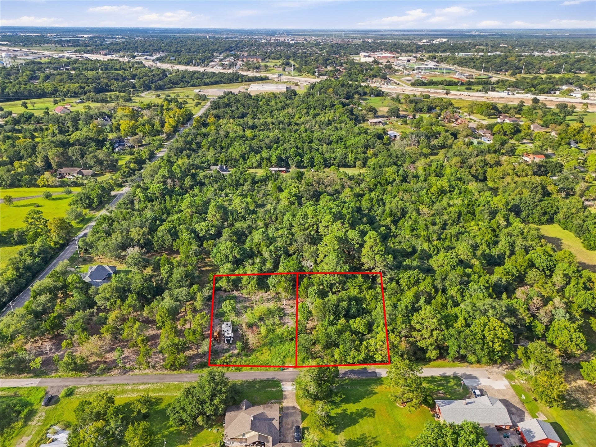 Lot 12 & 13 Moss St, La Marque, TX 77568 Aerial view highlighting both parcels and their road frontage.