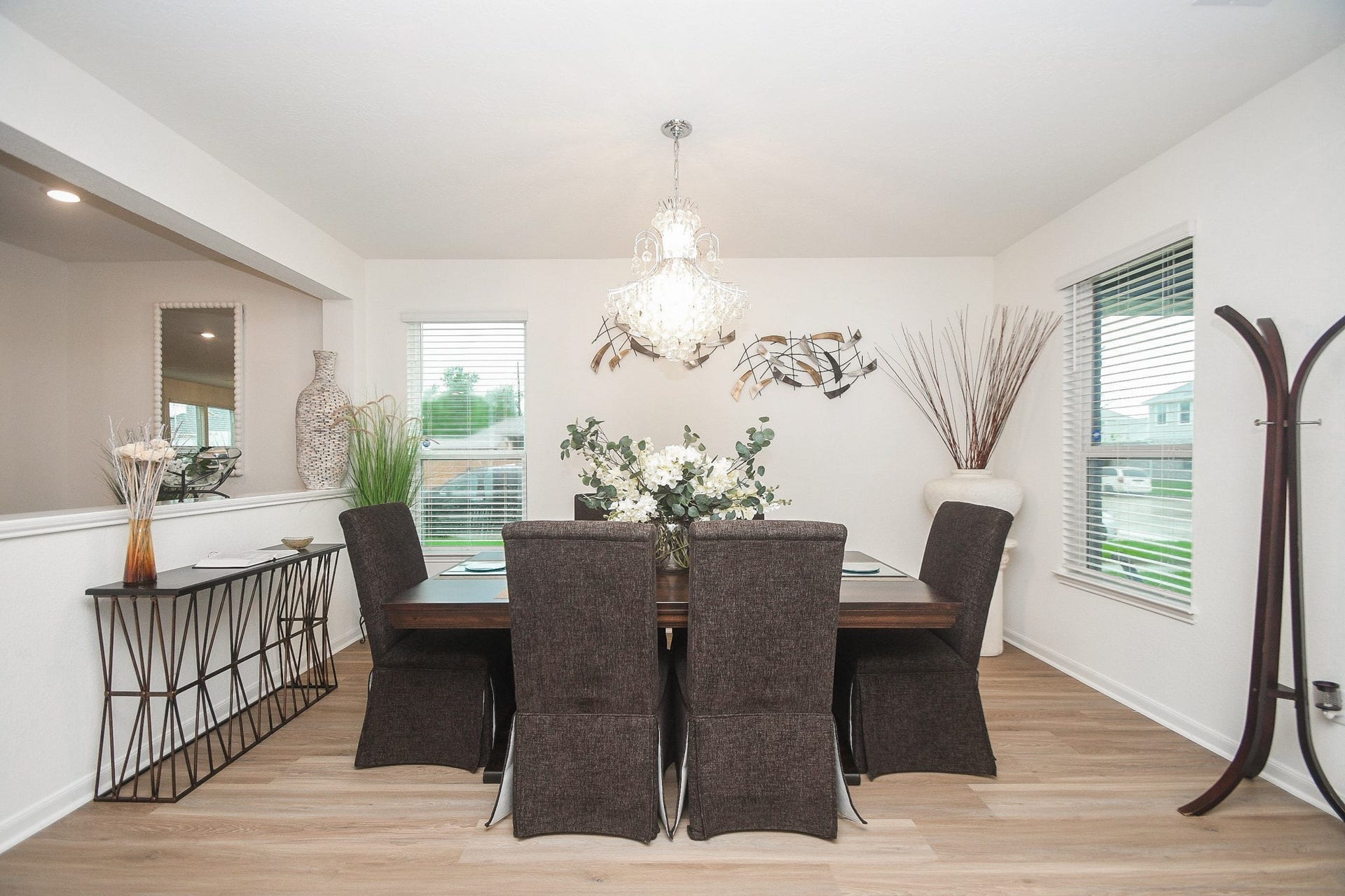 22523 Strathmore Drive, Richmond, TX 77469 Dining area with a beautiful, stylish chandelier open to the living area on the left.
