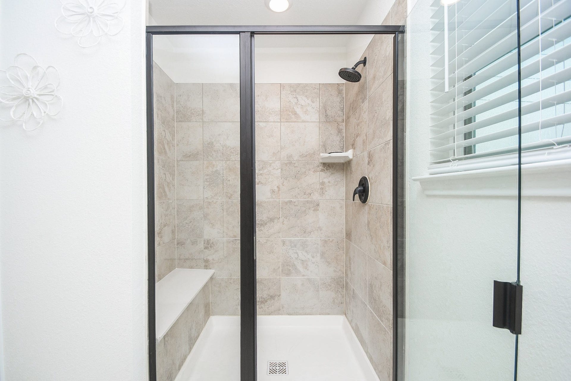 22523 Strathmore Drive, Richmond, TX 77469 Primary bedroom large refreshing shower with a seat for relaxation.