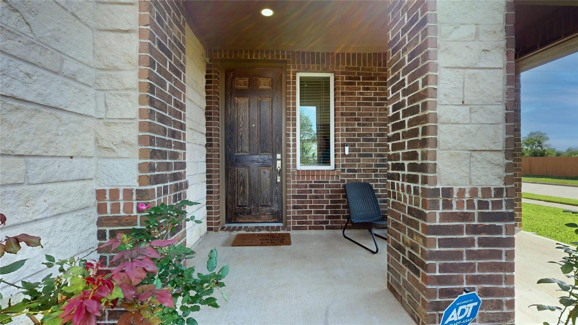 22523 Strathmore Drive, Richmond, TX 77469 Welcome home to 22523 Strathmore Drive. This charming home features a covered front porch entrance with a mix of brick and stone exterior and a sturdy wooden door.
