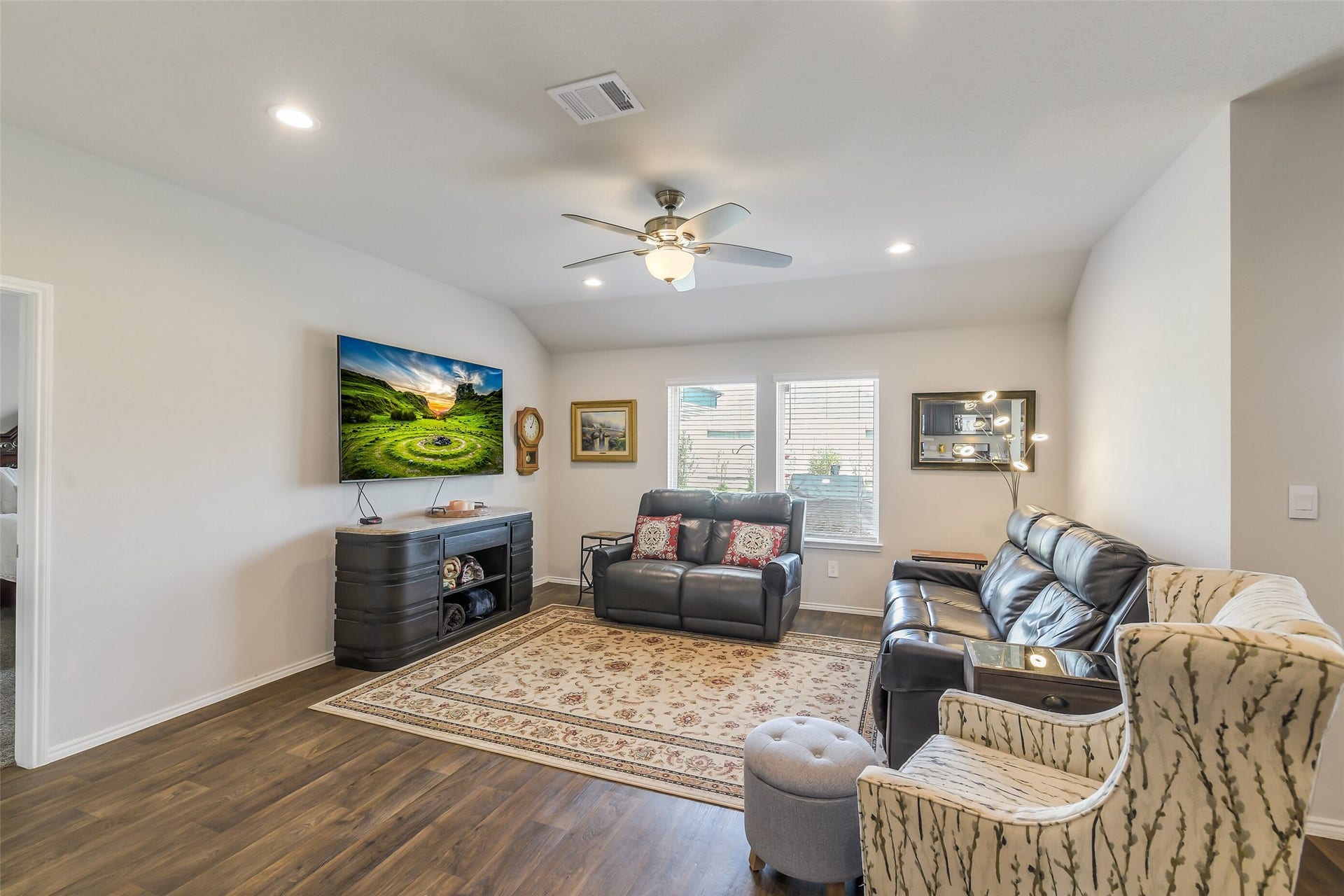 21225 Ivy Woods Court, New Caney, TX 77357 Another view of the living area, this is a HUGE TV but it looks small because the room is large.