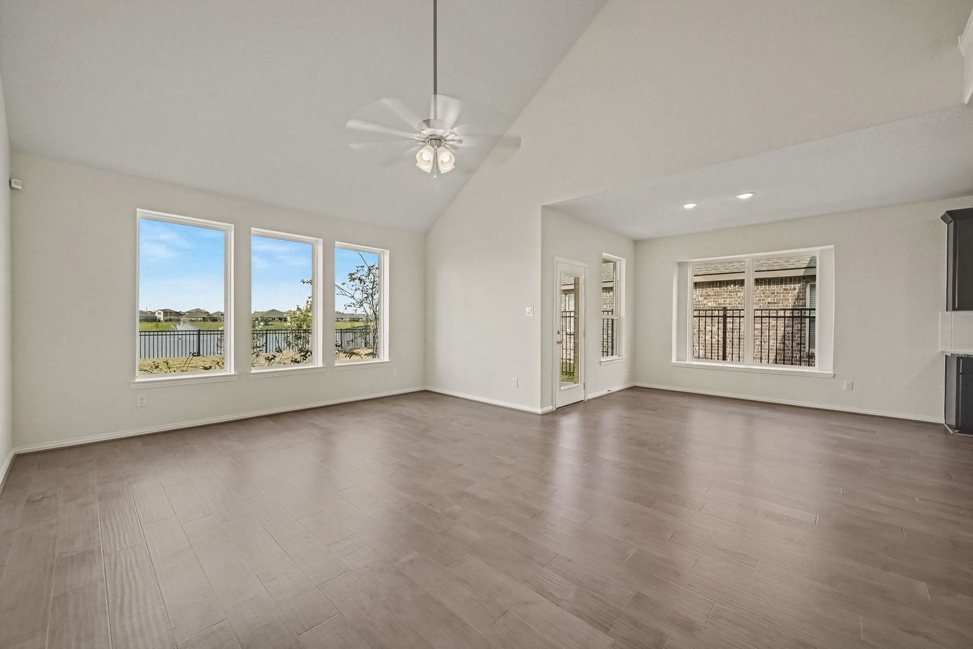 Living room and eat in kitchen overlooking the backyard lake view