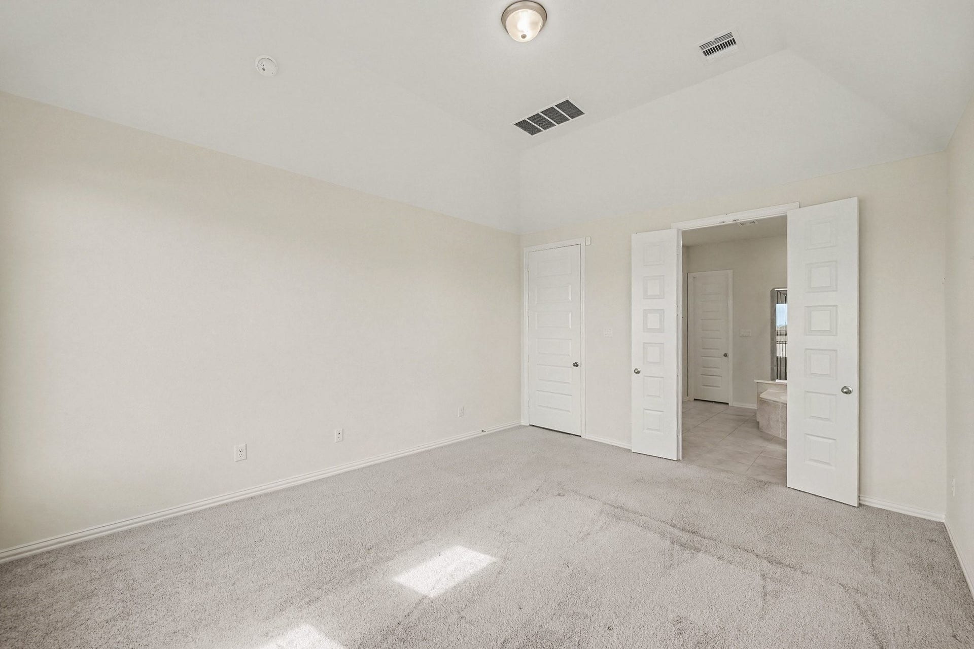 Primary bedroom with tons of natural light