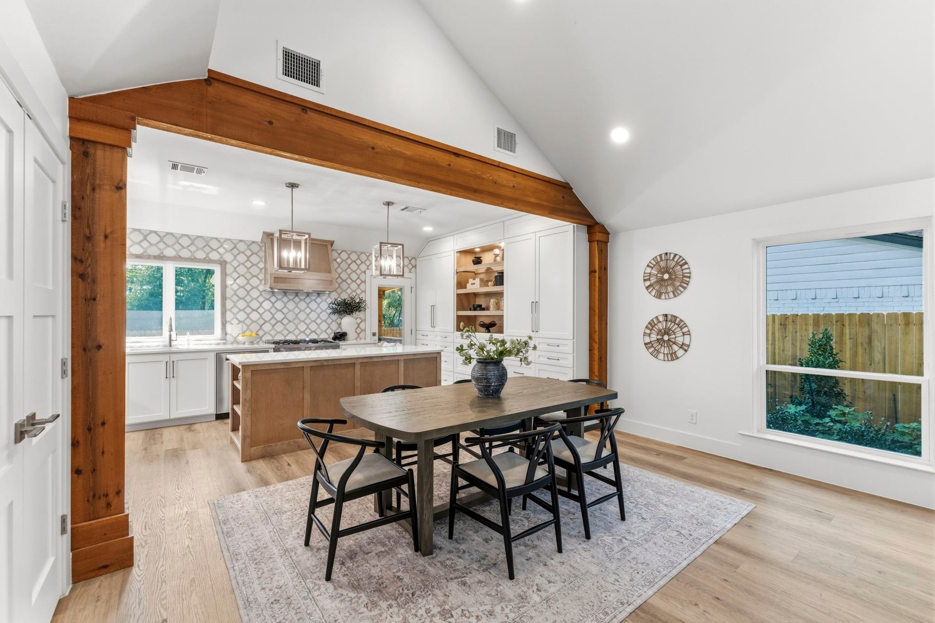 76 Woodhaven Wood Drive, The Woodlands, TX 77380 The dining area is perfectly positioned between the kitchen and living room, creating an ideal setting for everything from casual family meals to entertaining guests.