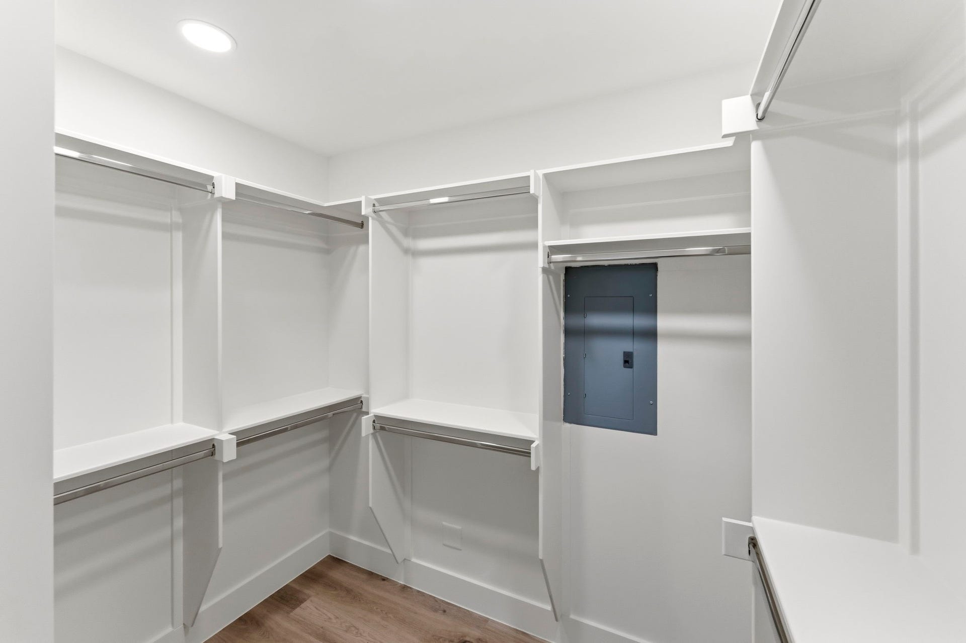 76 Woodhaven Wood Drive, The Woodlands, TX 77380 Primary closet boasts built-in shelving, double hanging rods, and dedicated storage areas, this spacious closet provides plenty of room for clothing, shoes, and accessories while keeping everything neatly organized and within easy reach.