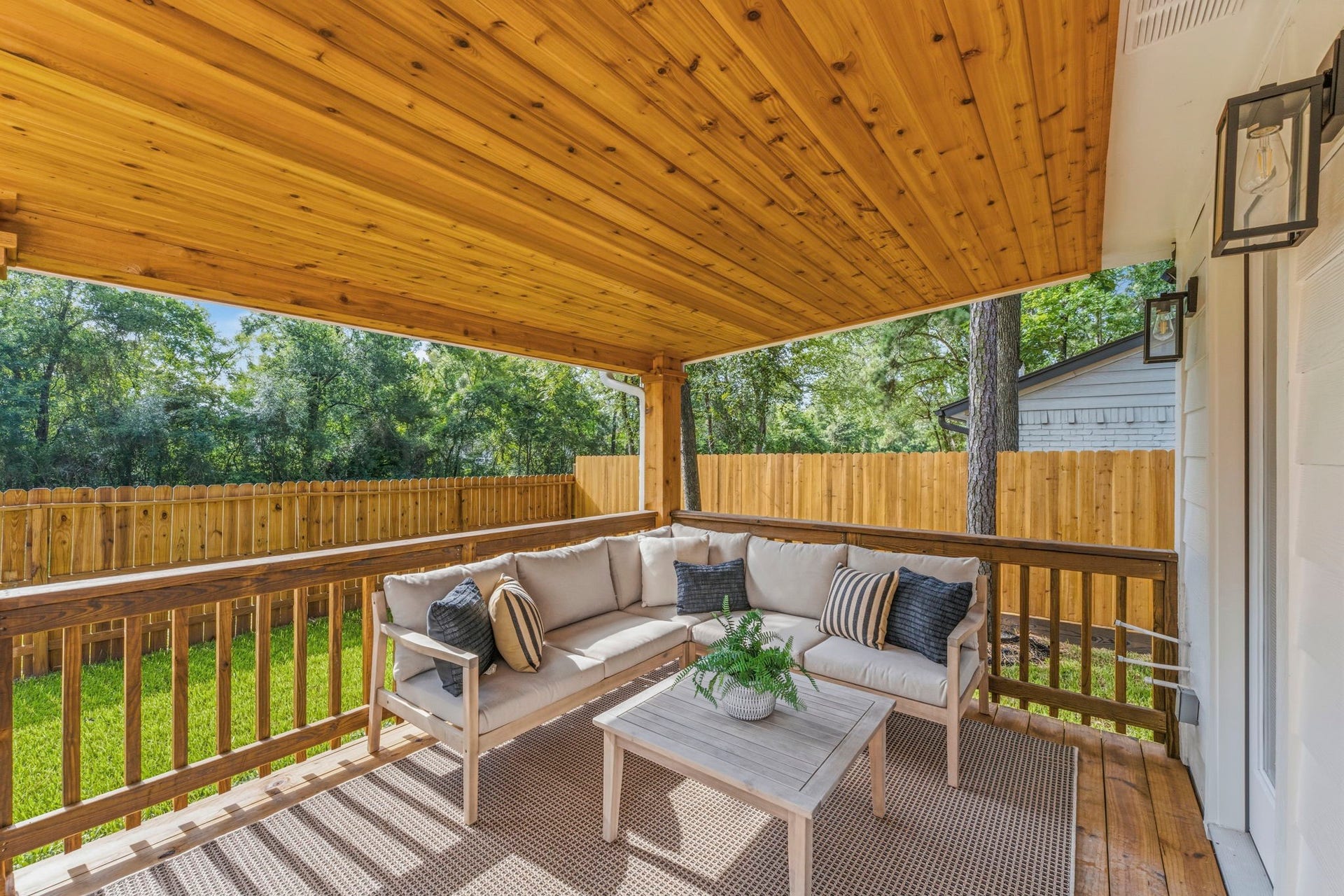 76 Woodhaven Wood Drive, The Woodlands, TX 77380 The brand-new covered patio creates an inviting extension of the home's living space.