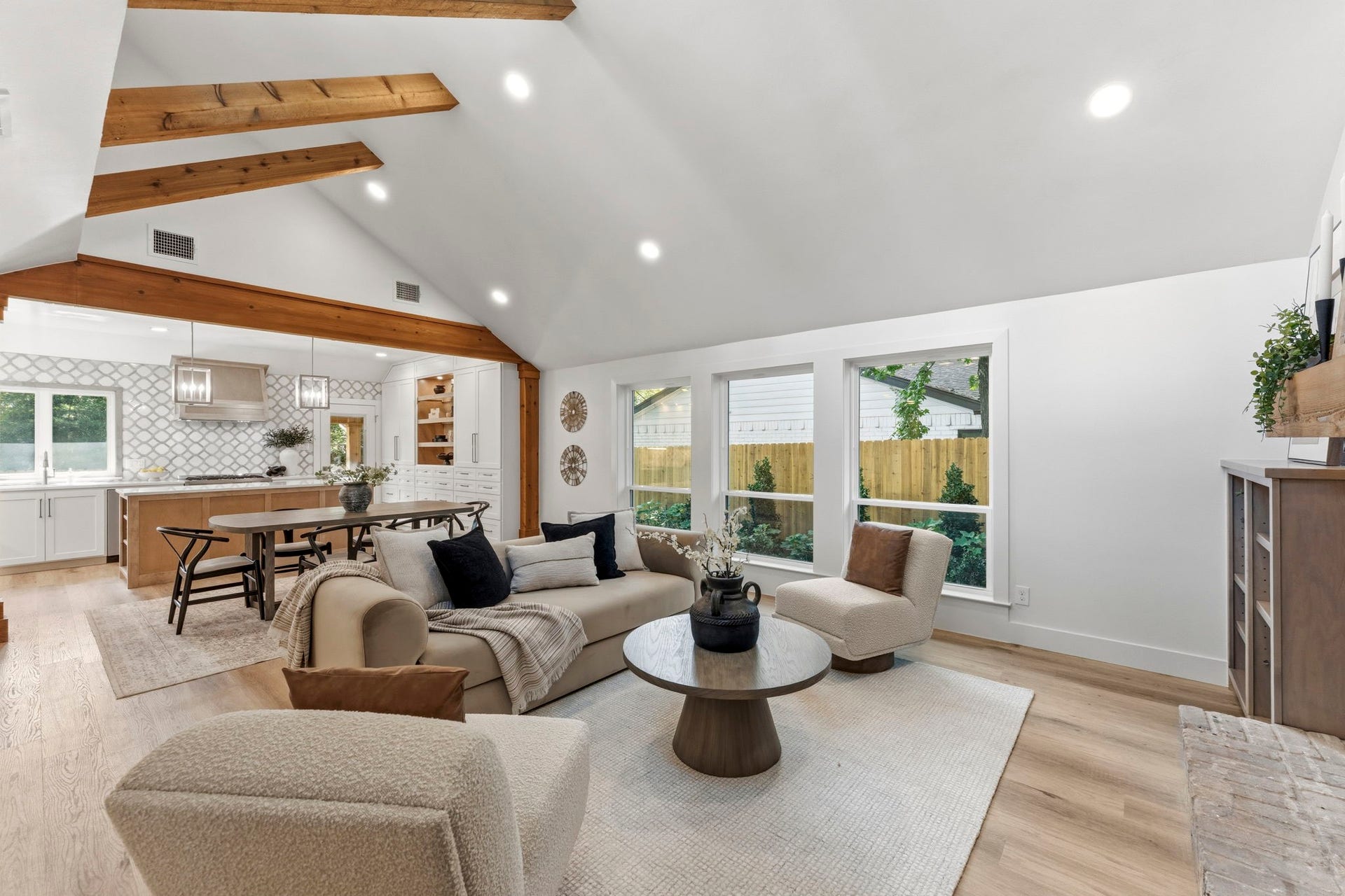76 Woodhaven Wood Drive, The Woodlands, TX 77380 Oversized windows frame peaceful views and fill the home with natural light, creating an inviting space you'll love spending time in every day.