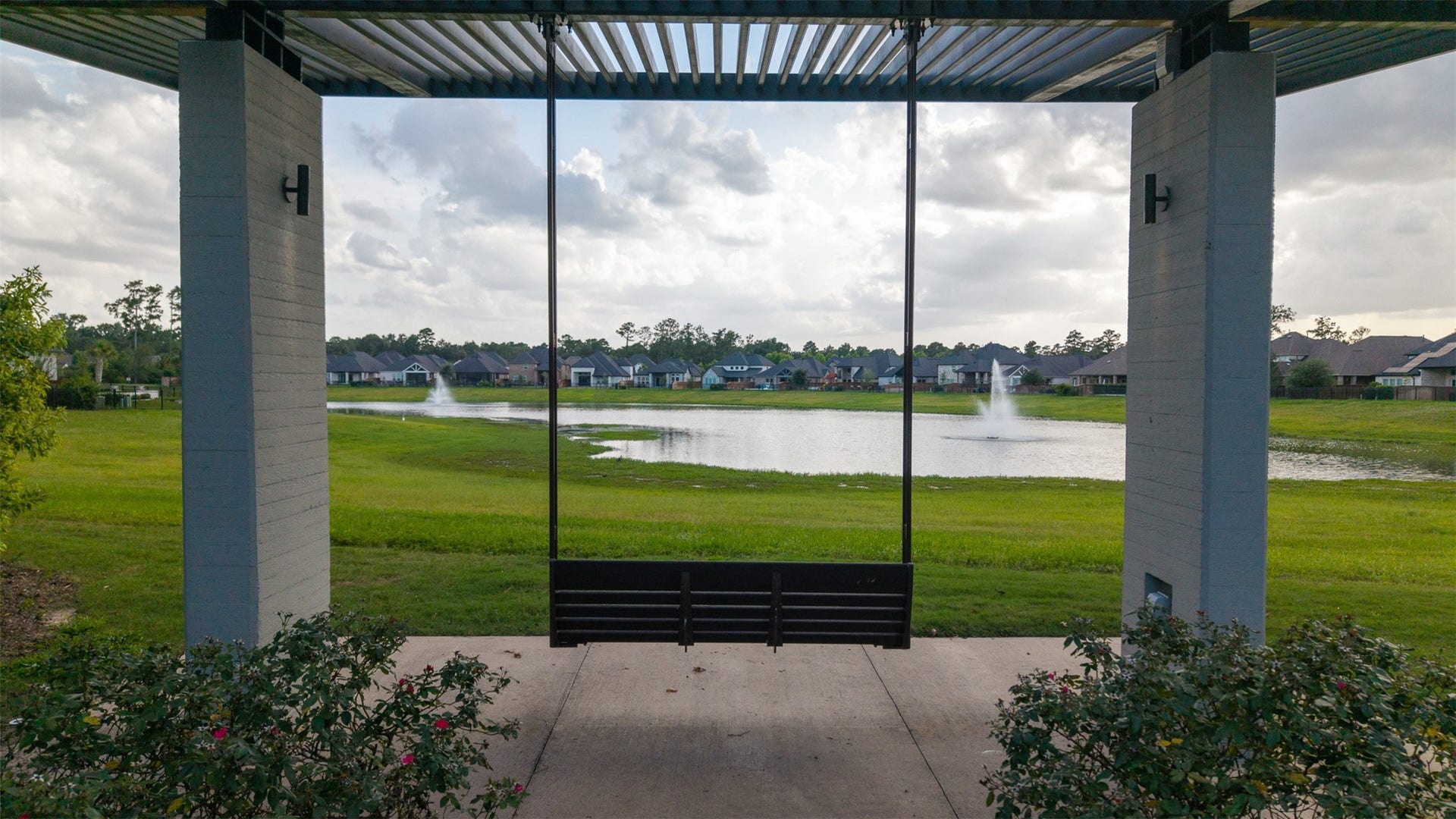28314 Emerald Bend, Spring, TX 77386 A covered pavilion swing frames tranquil views of the community catch-and-release pond, complete with central water fountains and expansive green spaces.