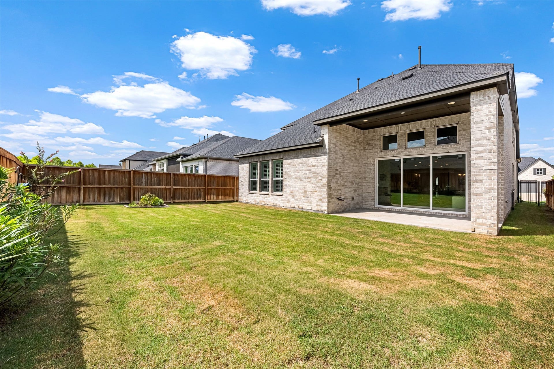 28314 Emerald Bend, Spring, TX 77386 A private fenced yard offers a sprawling green space and a covered patio, creating a wonderful setting for outdoor dining and recreation.