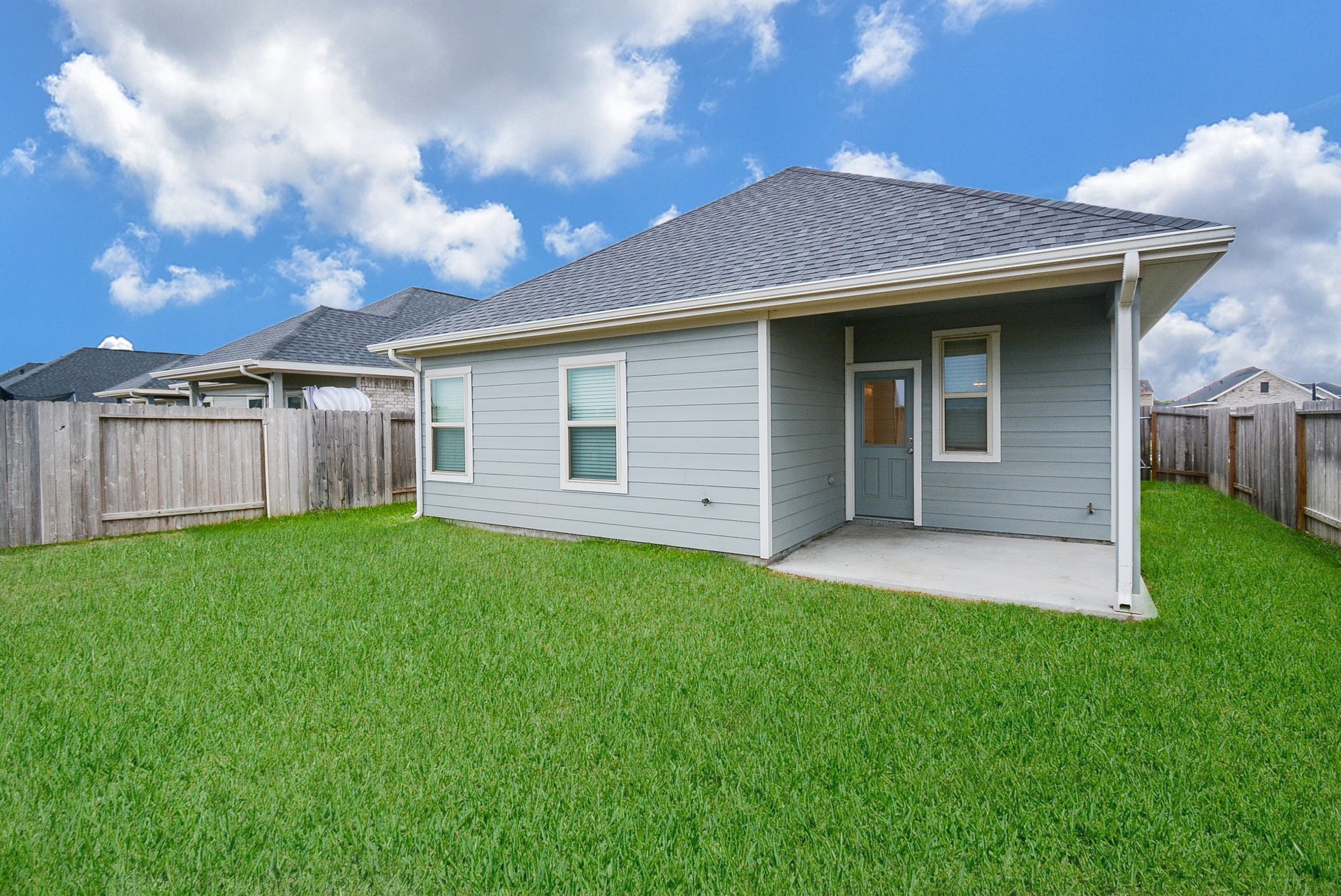 7450 French Quarter Court, Fulshear, TX 77441 Think about morning coffee out here under the covered patio.