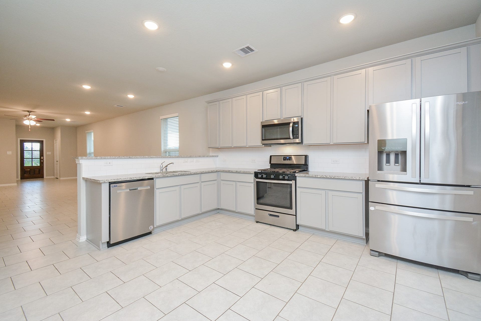 7450 French Quarter Court, Fulshear, TX 77441 Tremendous floor space lets both cooks and eager helpers happily coexist. There's room for breakfast nook pieces, too, if you use any of the living space for formal dining.