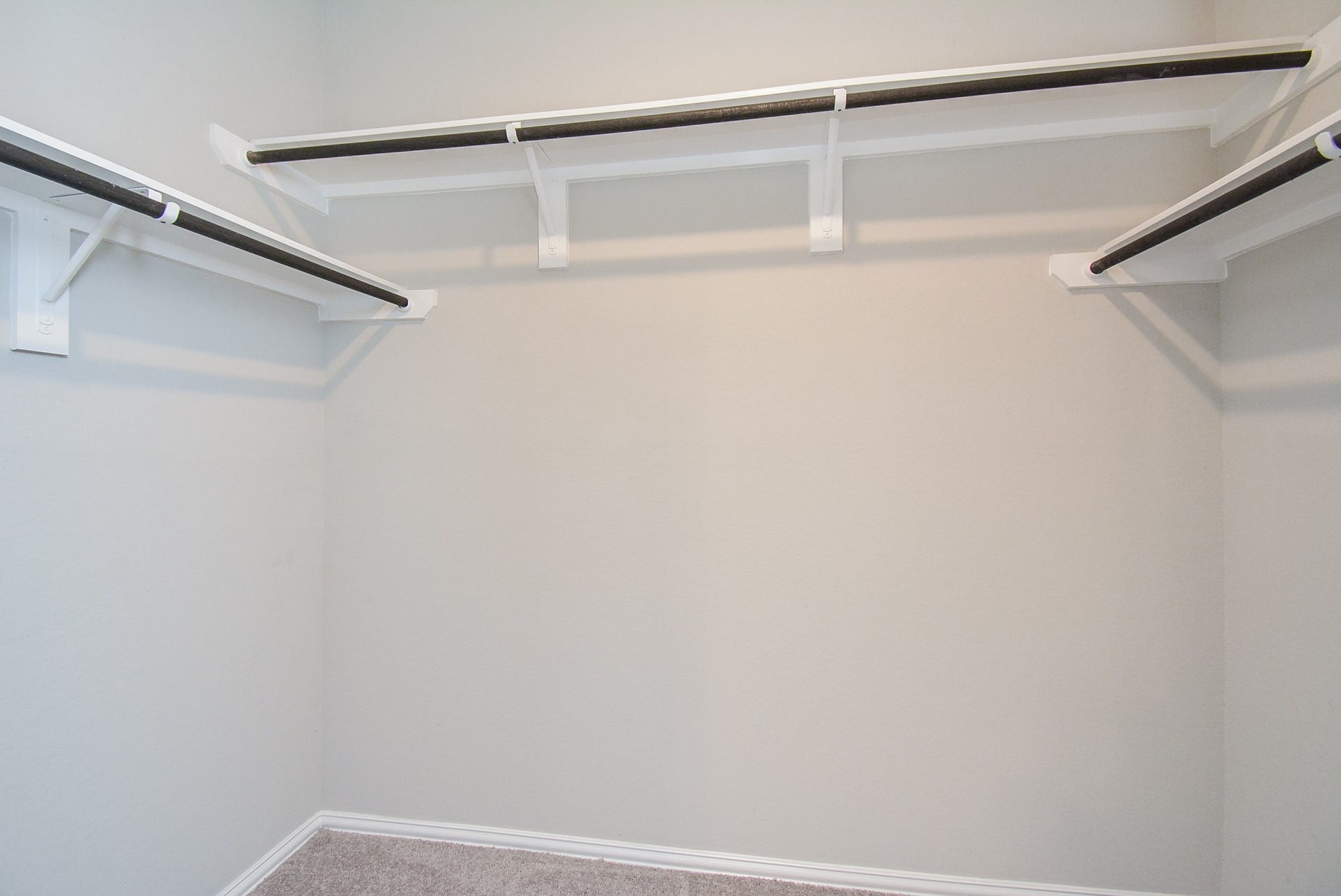 7450 French Quarter Court, Fulshear, TX 77441 One can never have too many closets --- especially if they look like this carpeted primary walk-in!