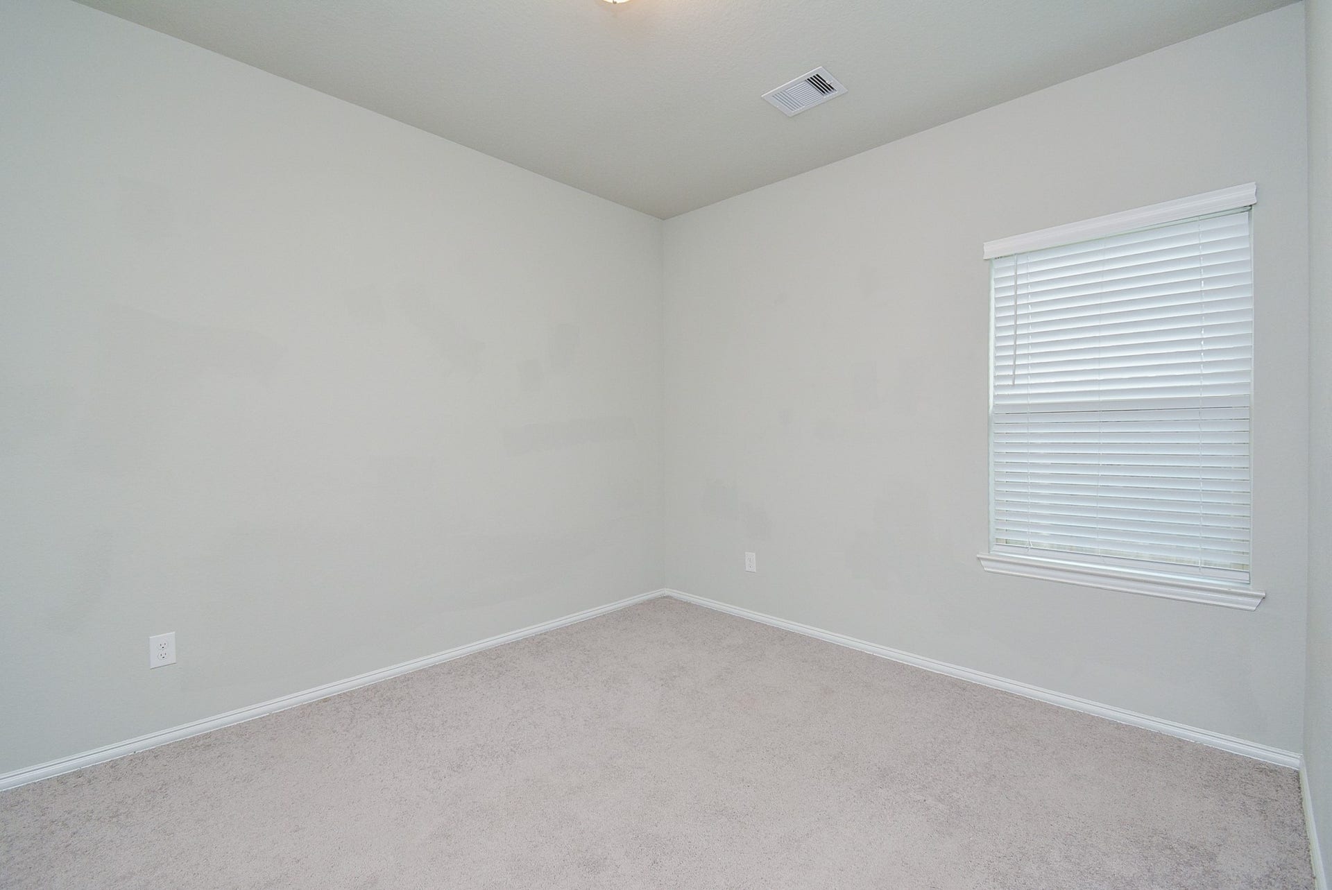 7450 French Quarter Court, Fulshear, TX 77441 A corner window in a secondary carpeted bedroom means more wall and floor space!
