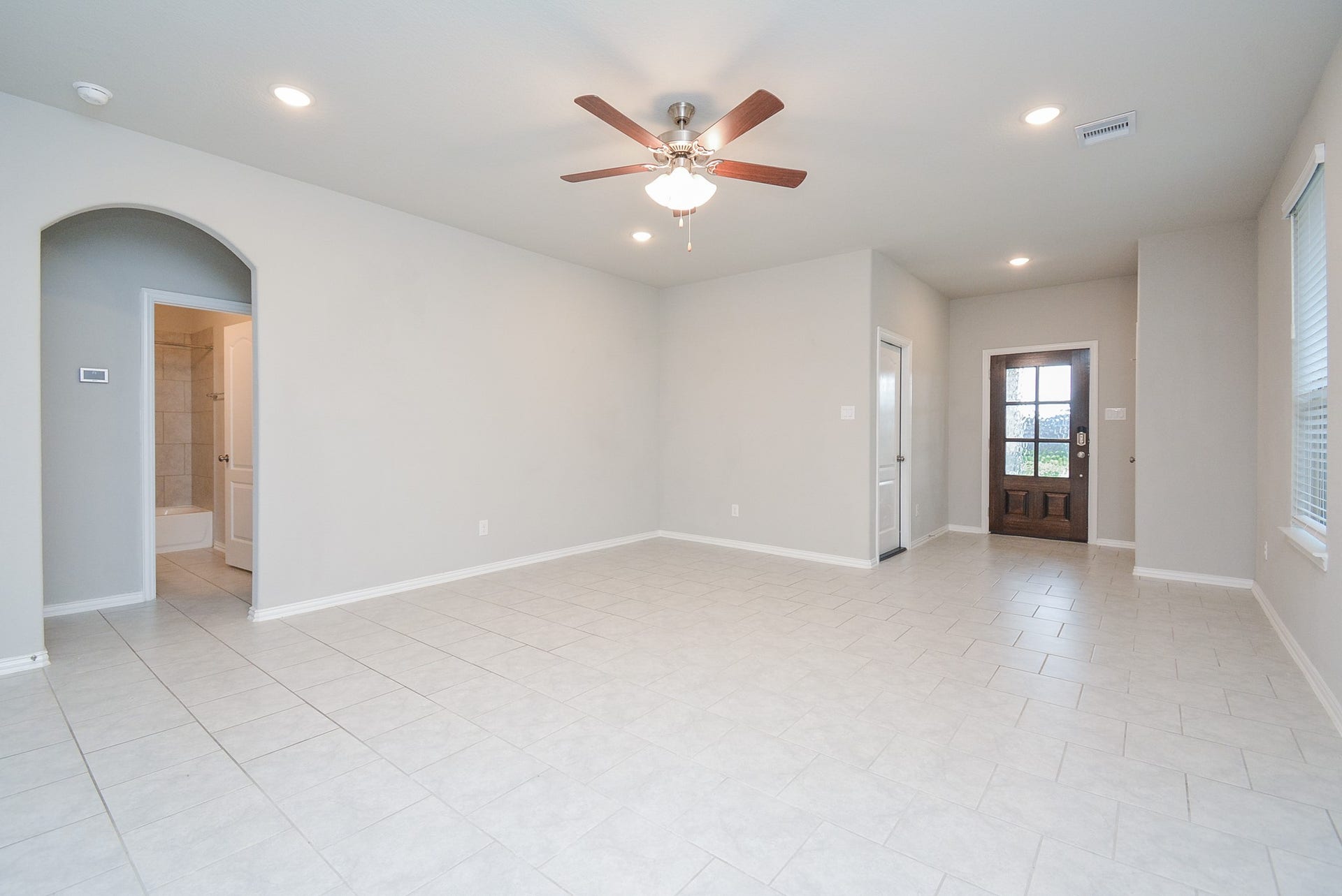7450 French Quarter Court, Fulshear, TX 77441 This is the enormous living/family area, with a high ceiling and room galore for your favorite pieces.