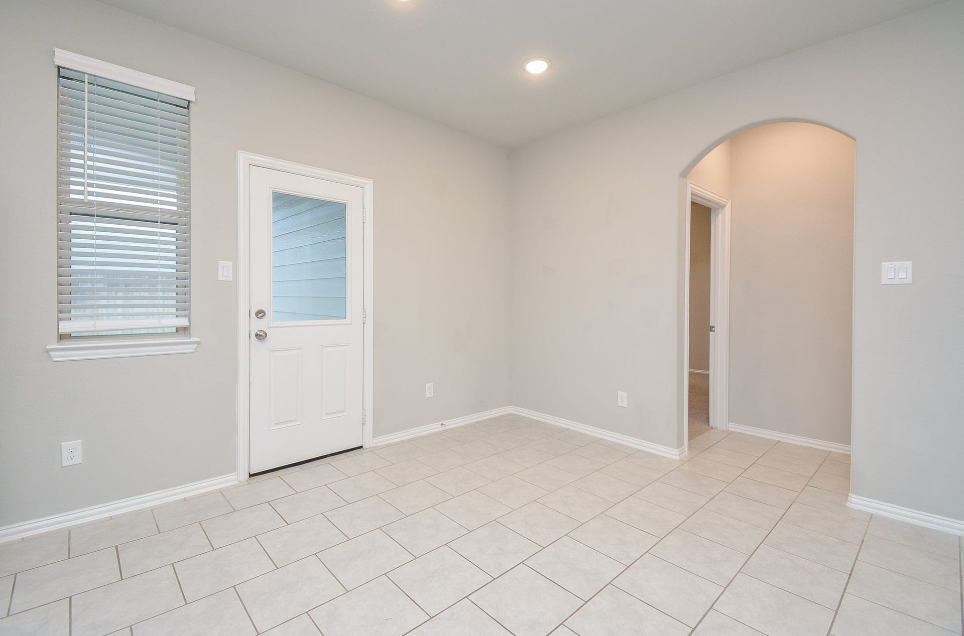 7450 French Quarter Court, Fulshear, TX 77441 A nice window and clear glass paned patio door bring added natural light into the space. Here's a better look at what can become a breakfast nook corner.
