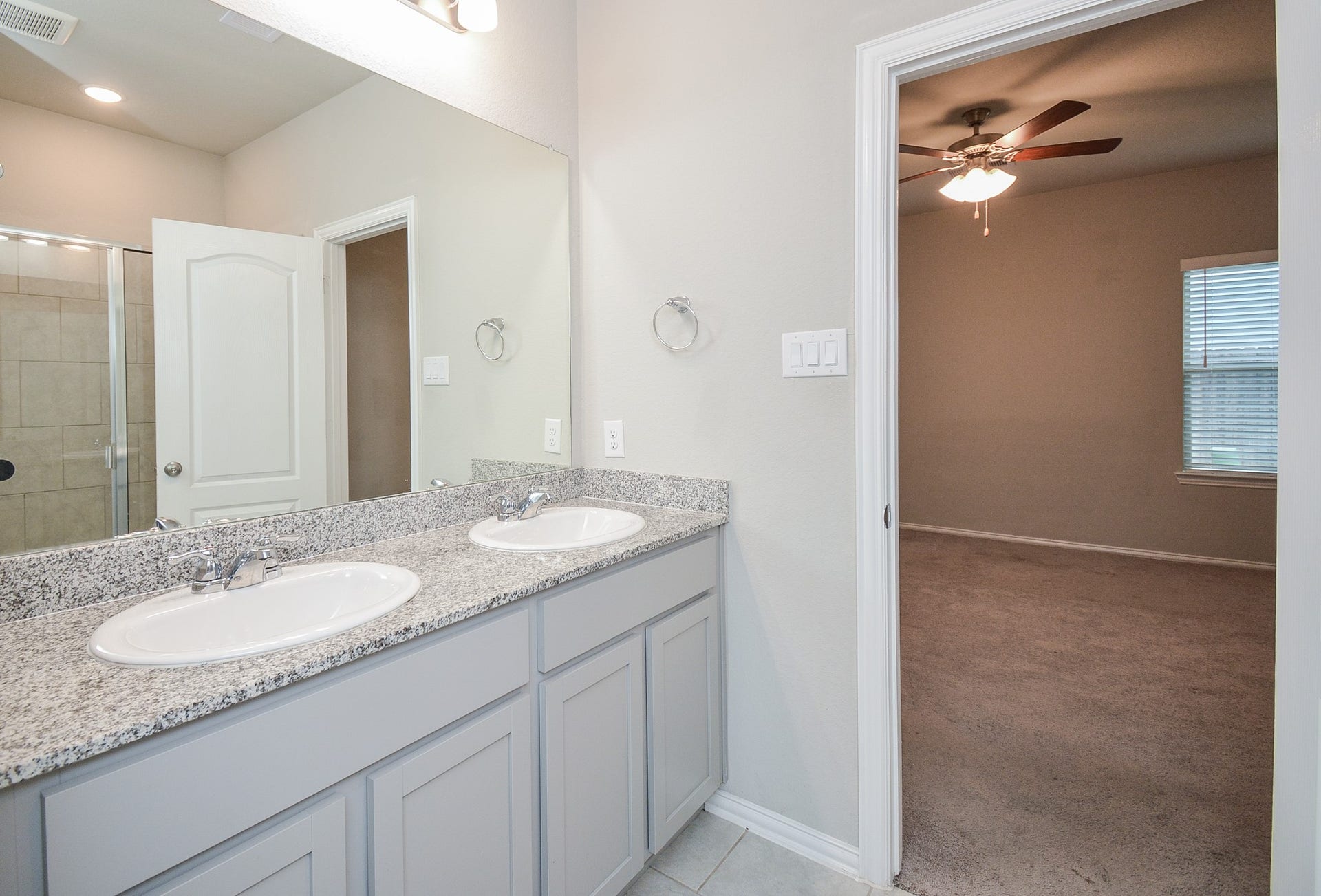 7450 French Quarter Court, Fulshear, TX 77441 Here's the view from the primary bath into the bedroom.
