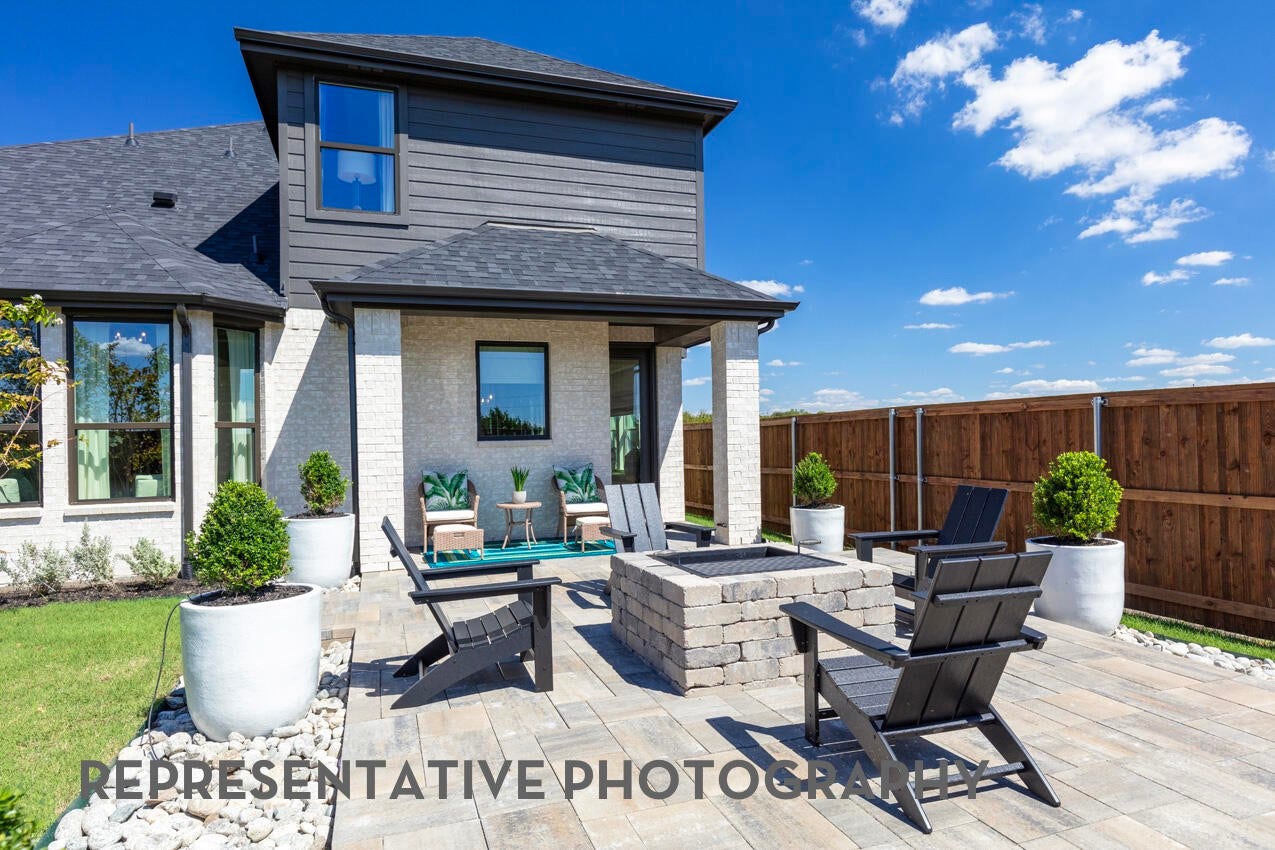 A covered patio offers a comfortable, shaded outdoor space perfect for gathering, relaxing, and entertaining year-round.