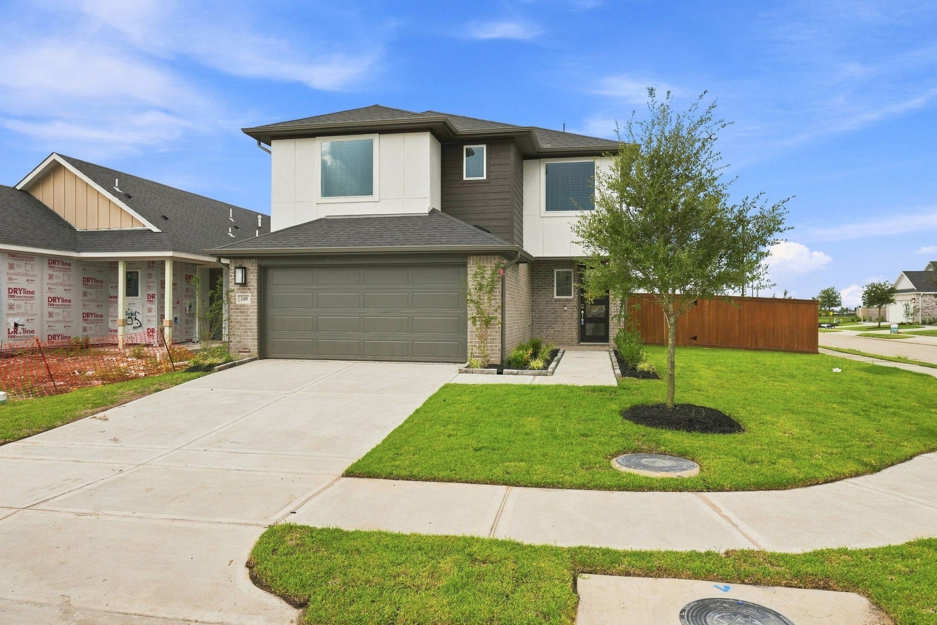 139 High Life Crossing, Richmond, TX 77469 Beautifully presented two-story Brand New Construction home with charming curb appeal, never lived in, and a well-kept front lawn, offering a welcoming first impression and a comfortable place to call home.