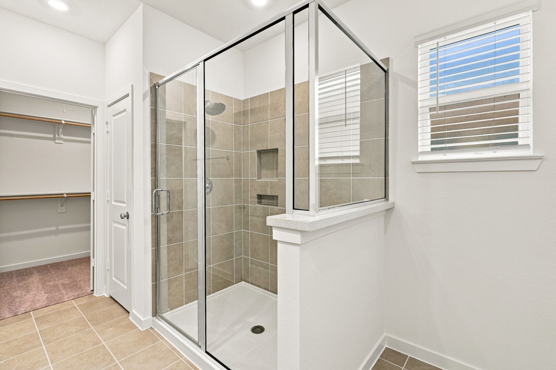 139 High Life Crossing, Richmond, TX 77469 Step into a glass-enclosed shower with shower niche which keeps everyday essentials conveniently within reach.