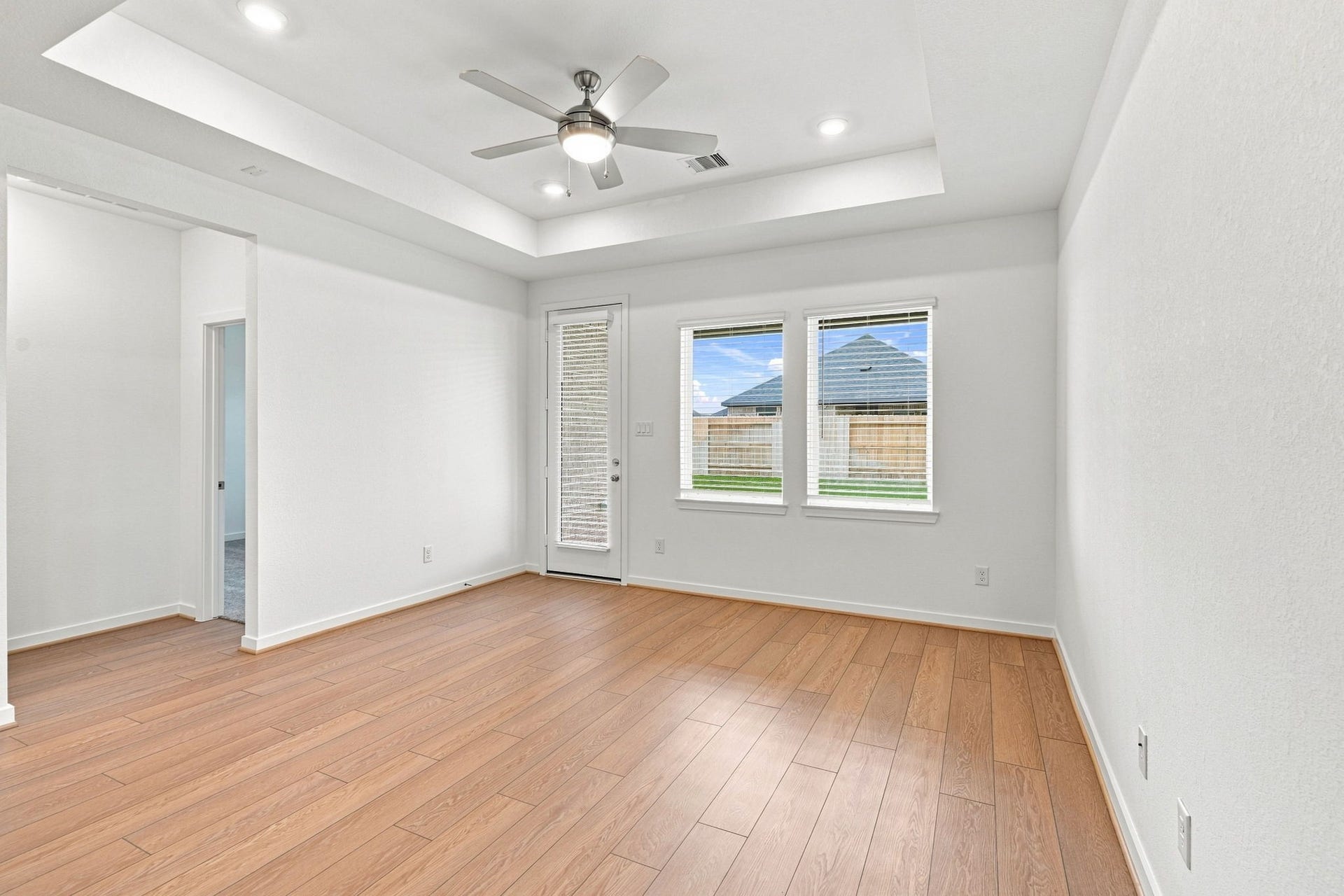139 High Life Crossing, Richmond, TX 77469 Versatile space with warm wood-style flooring, offering a polished backdrop that can easily adapt to your needs.