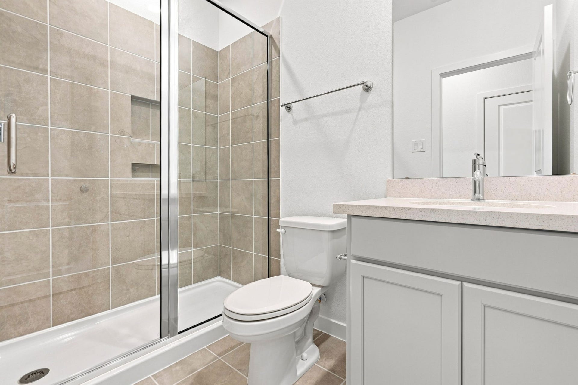 139 High Life Crossing, Richmond, TX 77469 Family and guests can enjoy their own upstairs bath with a glass-enclosed shower and a practical layout that keeps daily routines moving.