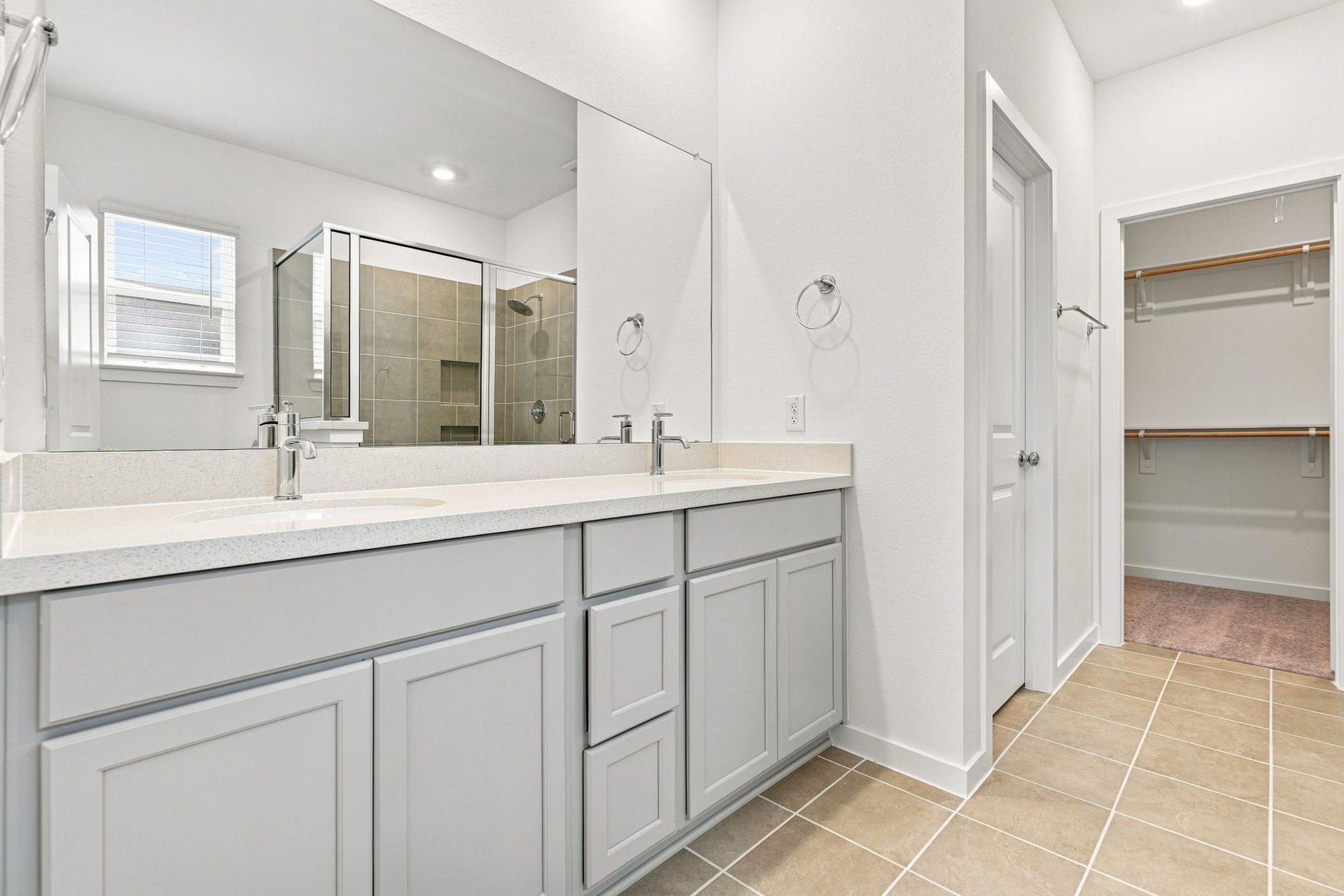 139 High Life Crossing, Richmond, TX 77469 Make busy mornings easier with dual sinks, separate getting-ready space, and built-in cabinetry that keeps the primary bath clean and organized.