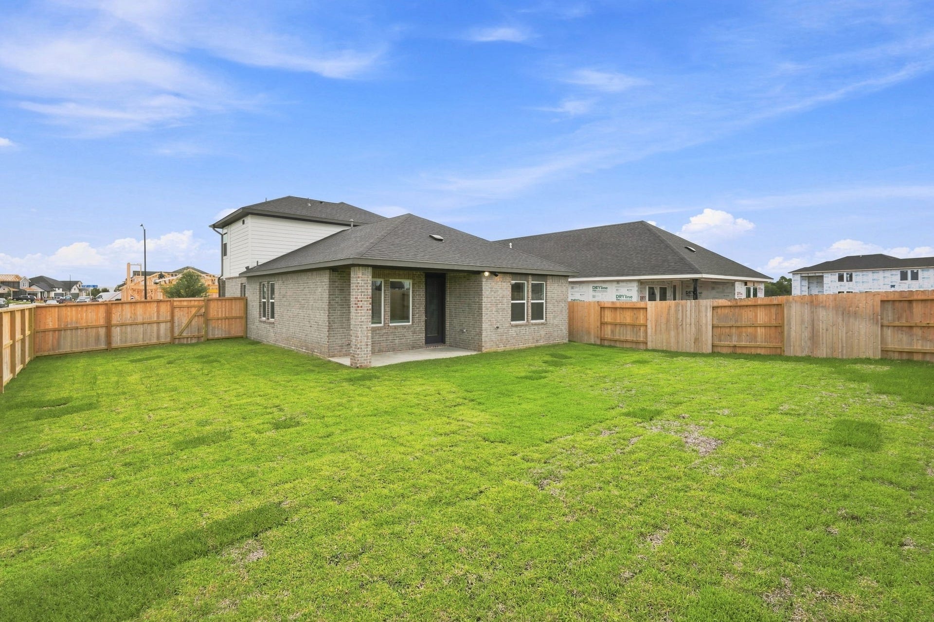 139 High Life Crossing, Richmond, TX 77469 Enjoy privacy and space in this brand-new home's fully fenced backyard, featuring a covered patio and fresh sod ready for outdoor entertaining