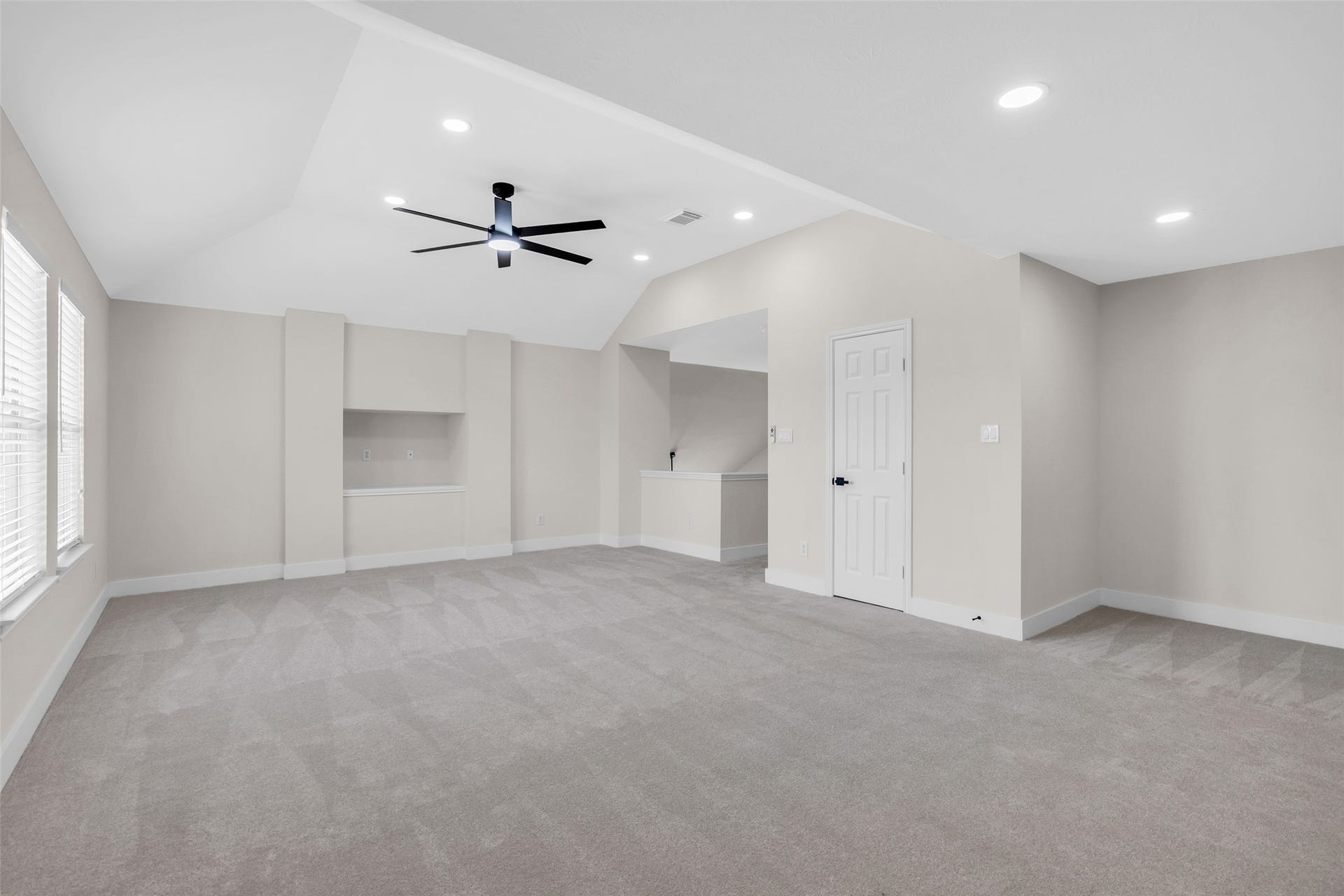 22002 Madera Canyon Court, Richmond, TX 77469 Spacious game room with plush carpeting, modern ceiling fan, and ample natural light