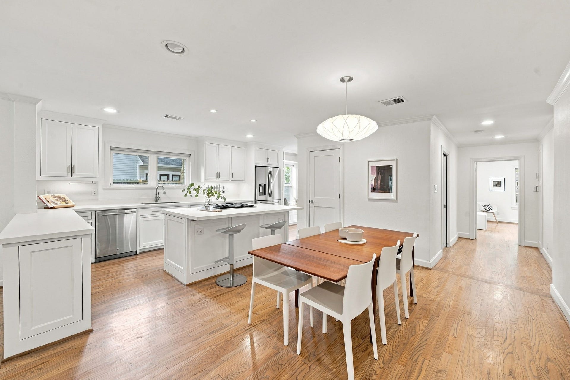 Dining area between the kitchen and living room. Refinished hardwoods, double-pane windows (2019).