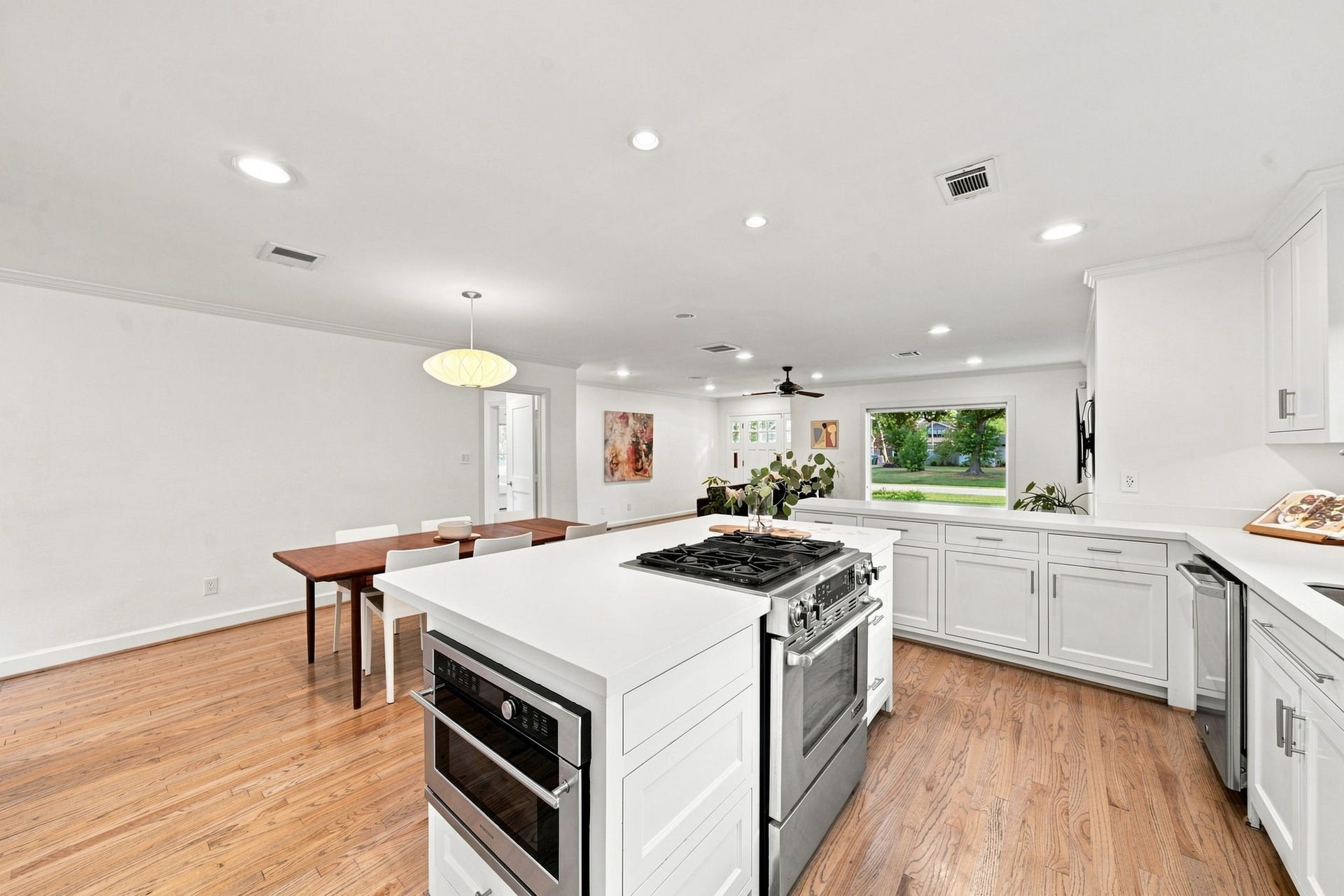 Kitchen island looking toward the living room and front door. One open main level.
