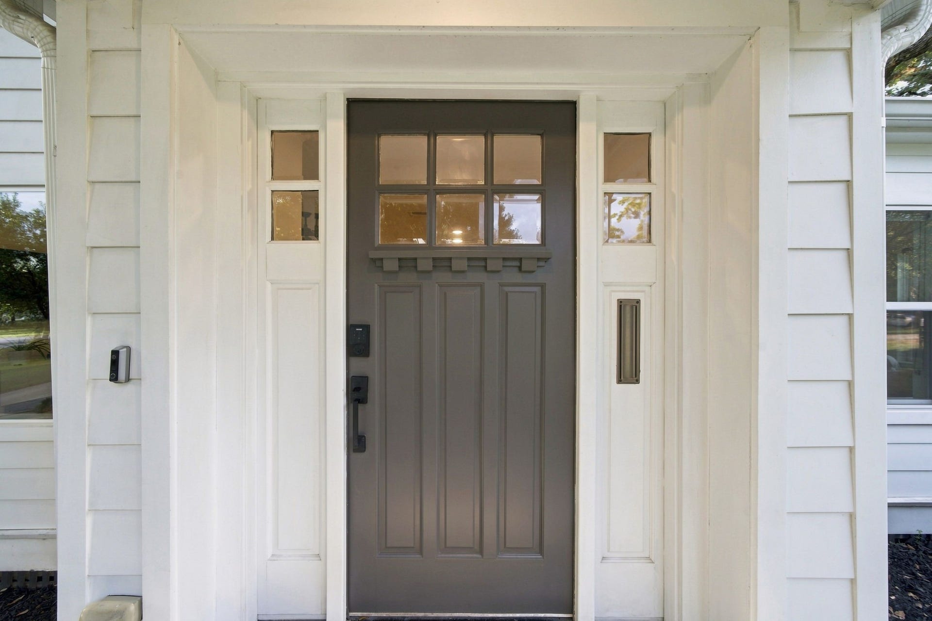 Front porch repainted 2026. HardiePlank siding and double-pane windows, both 2019.