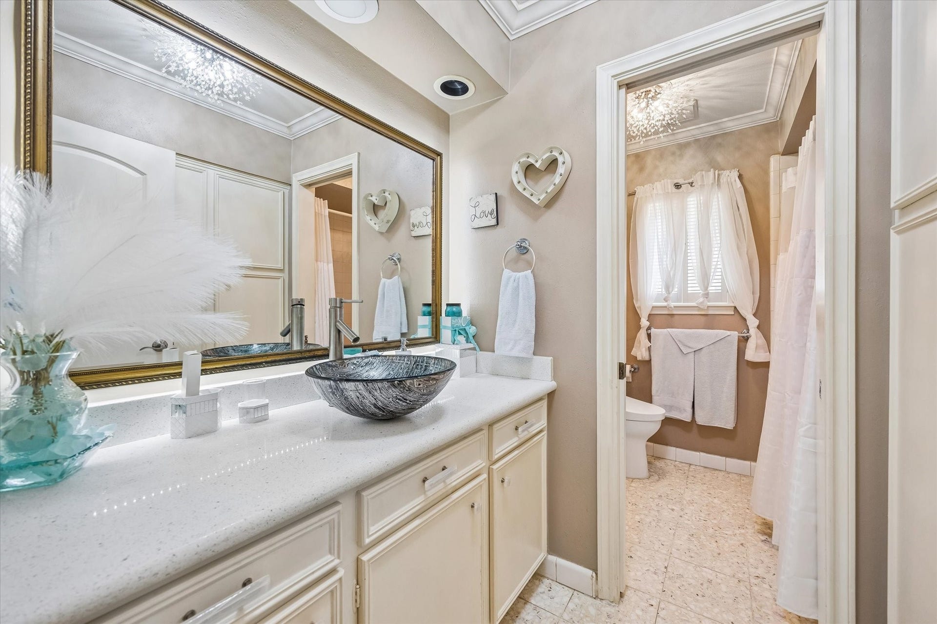 818 Olney Oak Drive, Houston, TX 77079 Hallway bathroom featuring many updates as well as sliding door between vanity and shower room