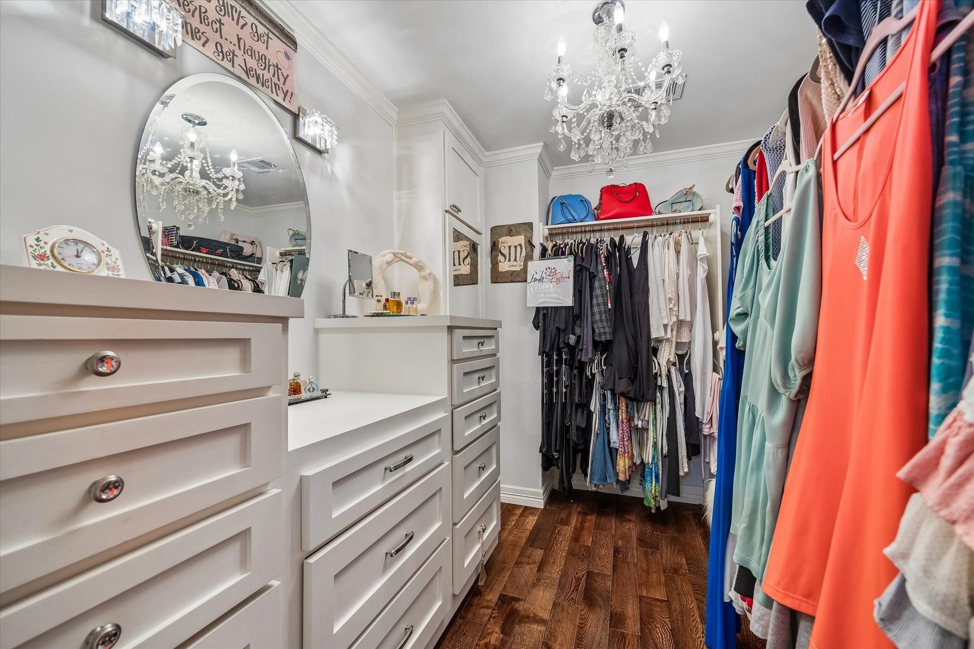 818 Olney Oak Drive, Houston, TX 77079 Custom closet with hidden shoe closet behind mirror at back left