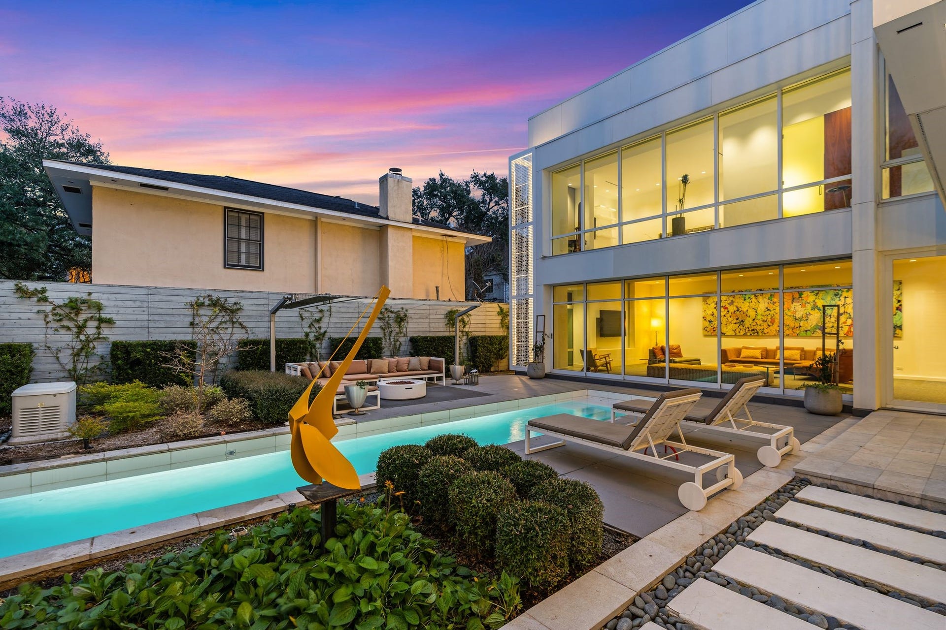 1509 Banks Street, Houston, TX 77006 At dusk, the home glows inwardframing the courtyard as its true focal point.