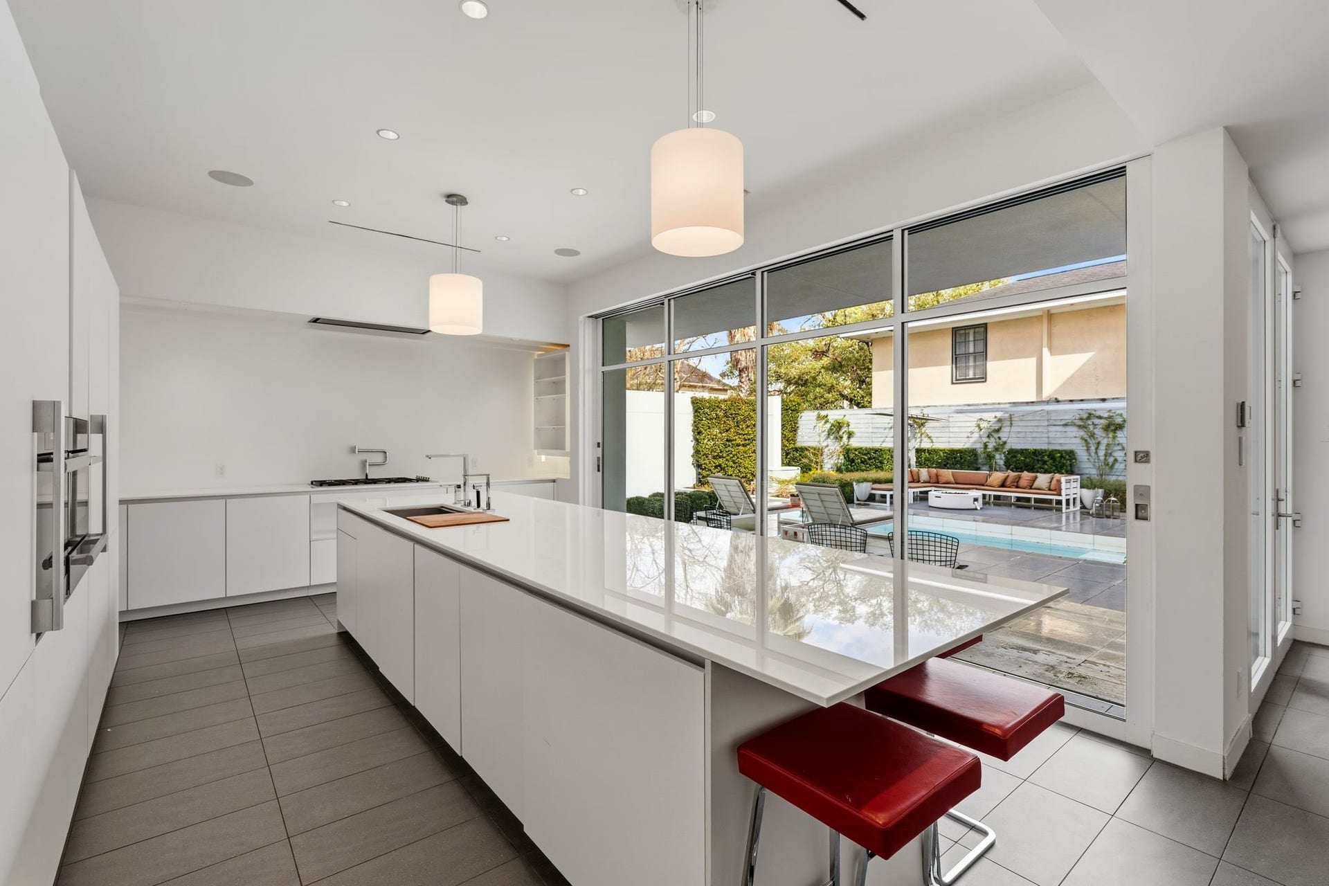 1509 Banks Street, Houston, TX 77006 Minimalist cabinetry conceals, while glass walls reveal.