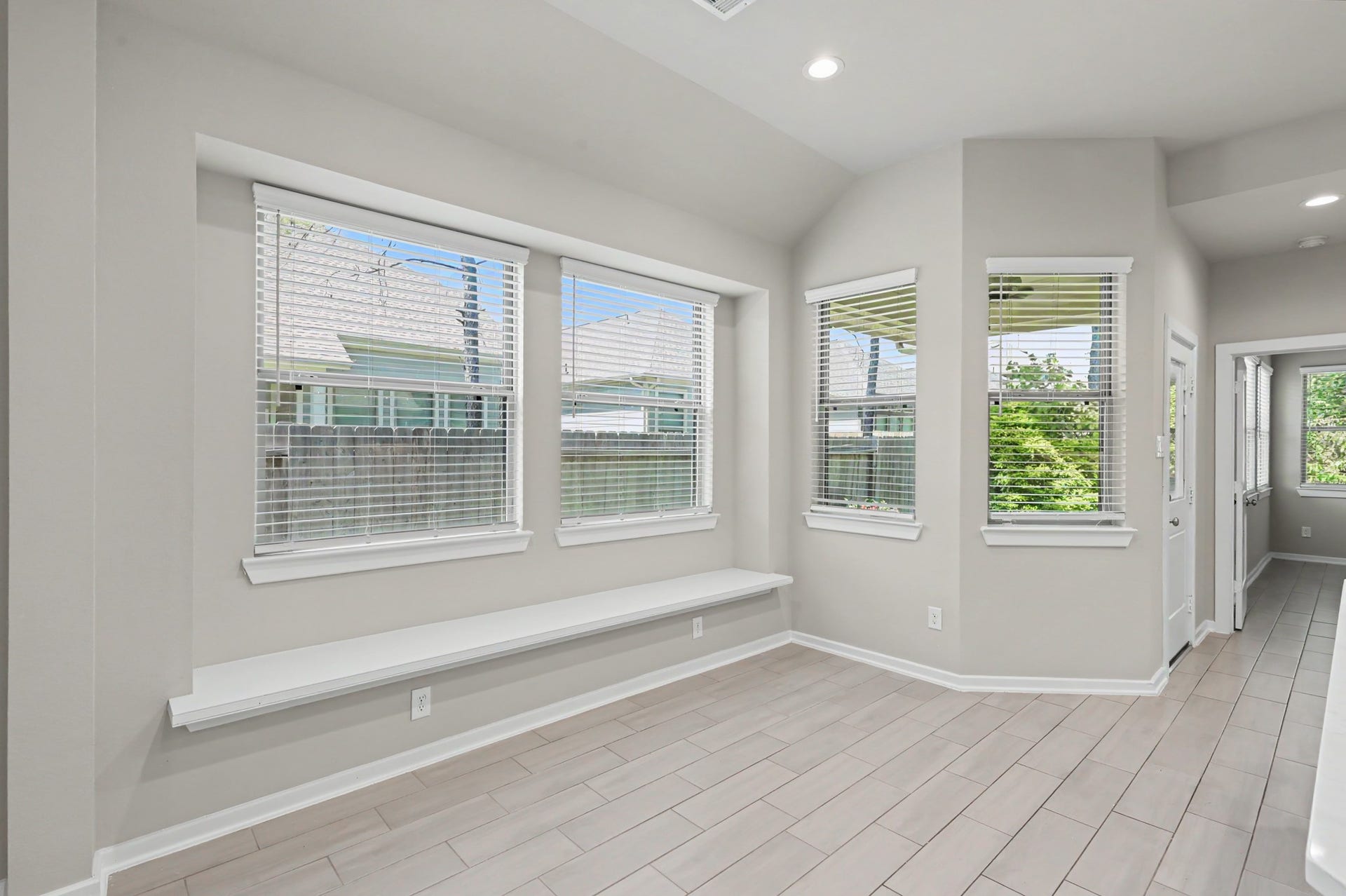 Breakfast nook has built-in seating.