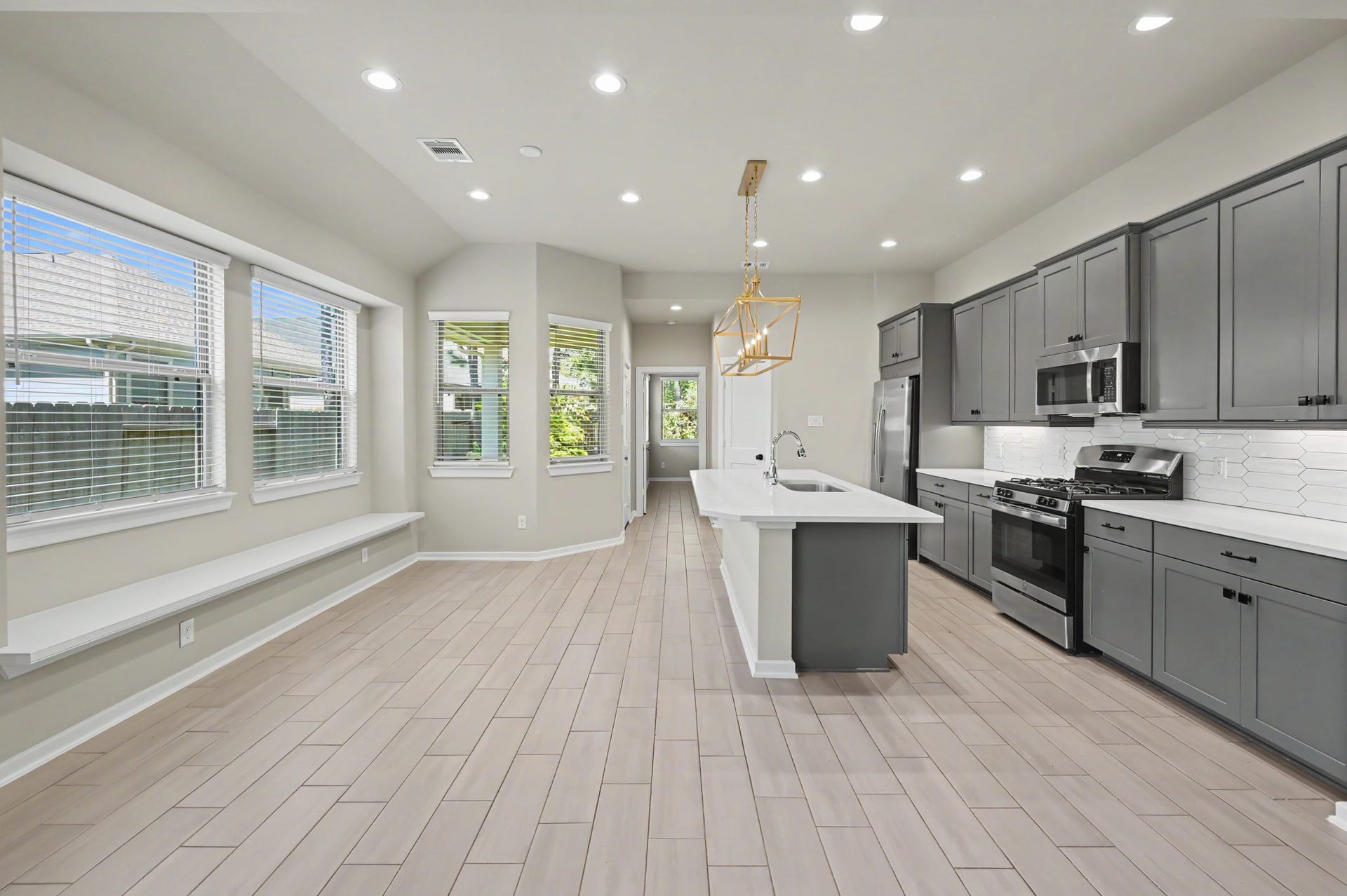 Kitchen open to breakfast nook w/ plenty of natural light
