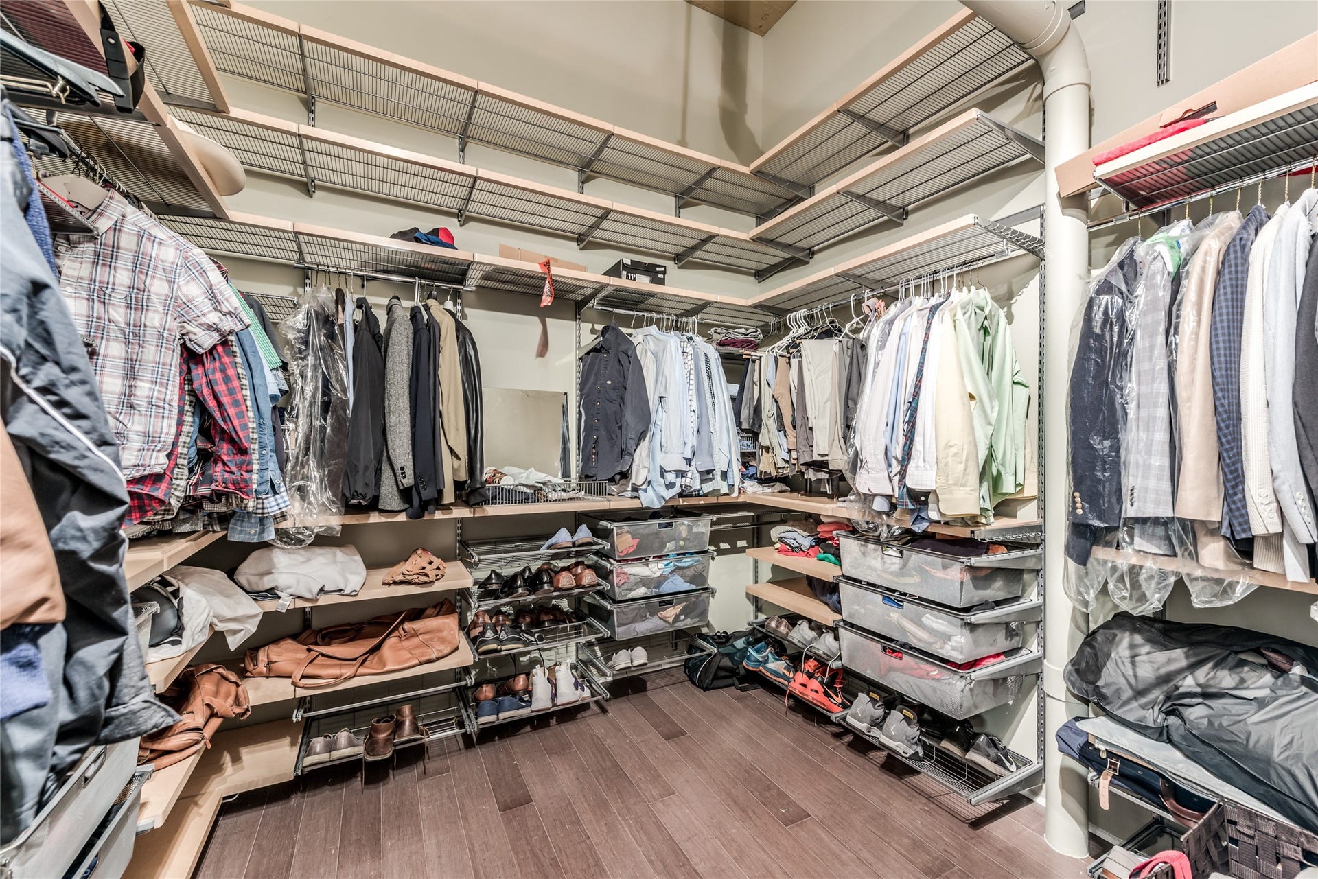705 Main Street, #215, Houston, TX 77002 This spacious walk-in closet features ample shelving and hanging space, perfect for organizing clothing and accessories.