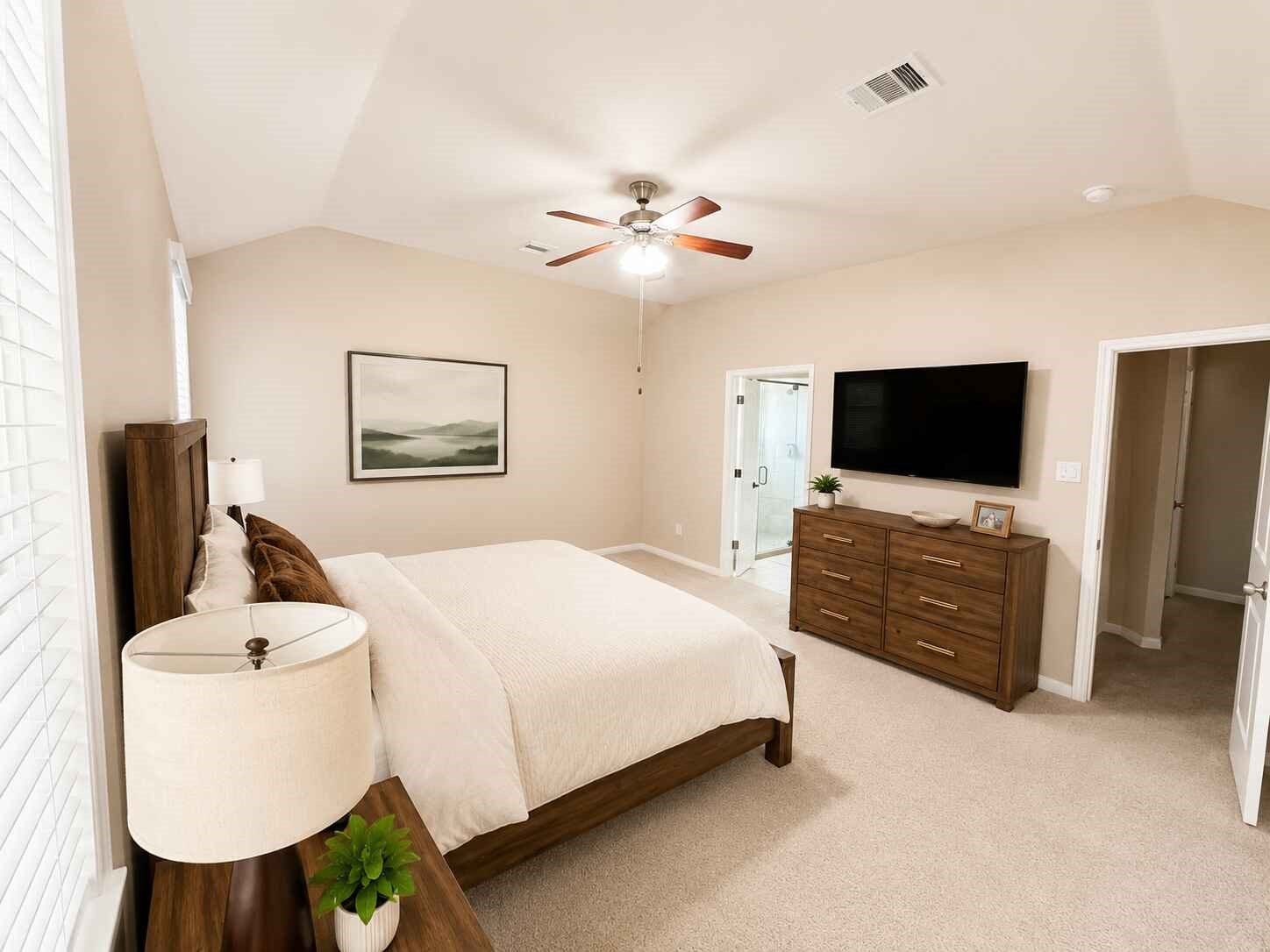 21570 Spear Valley Lane, Porter, TX 77365 Generously sized primary suite features a vaulted ceiling, abundant natural light and plenty of room for a full bedroom set, with convenient access to the private en-suite bath and walk-in closet