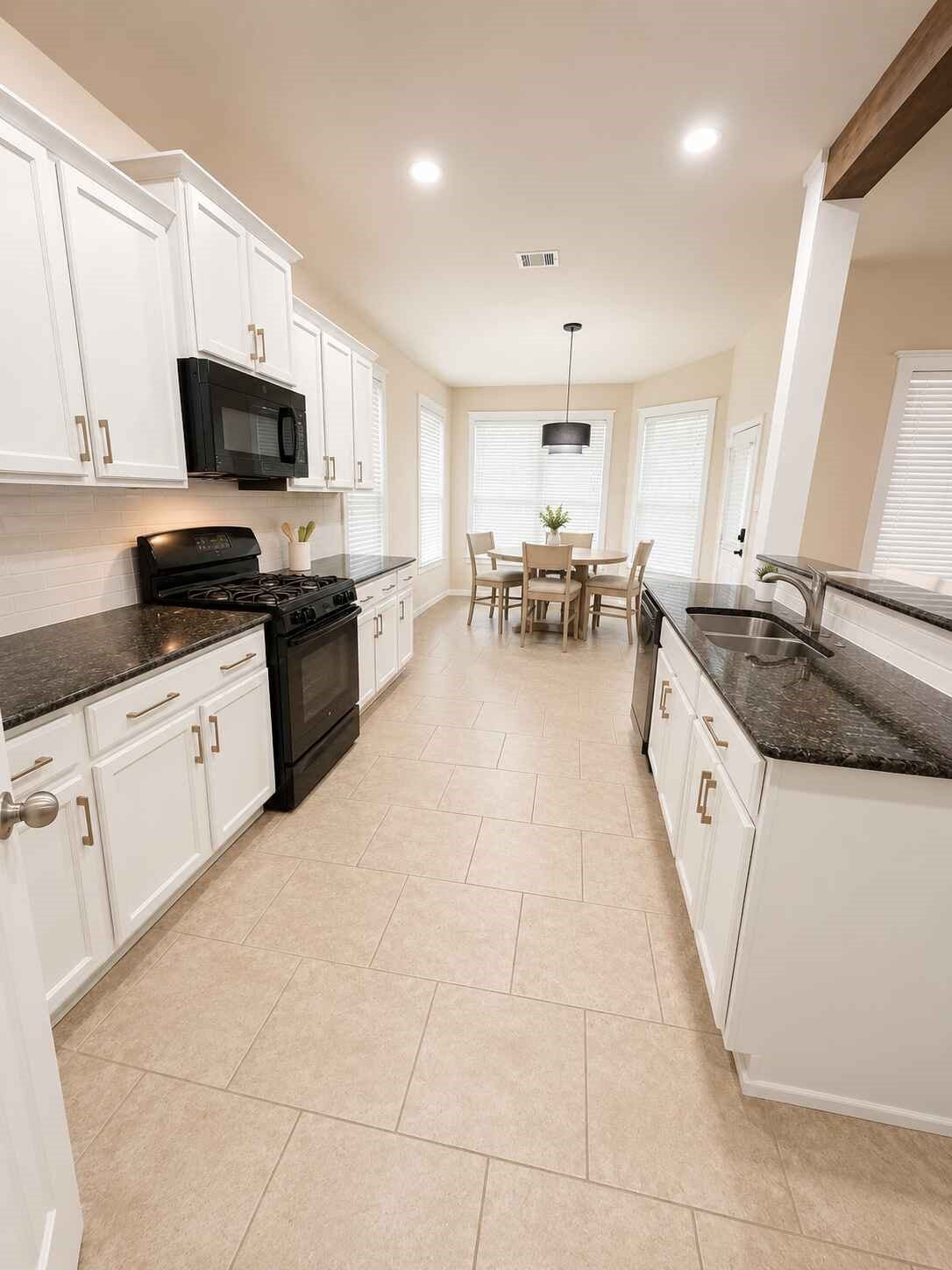 21570 Spear Valley Lane, Porter, TX 77365 Bright, updated kitchen features crisp white cabinetry, granite countertops, abundant storage and an open breakfast area surrounded by windowsperfect for casual meals and morning coffee