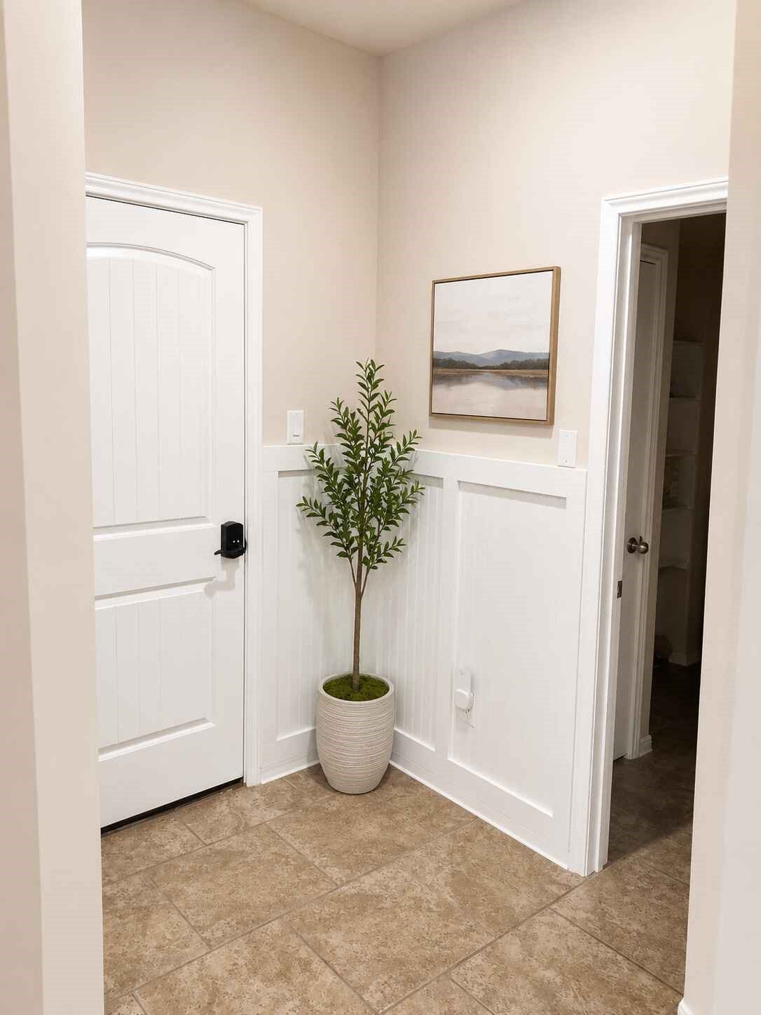 21570 Spear Valley Lane, Porter, TX 77365 Convenient secondary entry features durable tile flooring, decorative wall detail and easy access to additional living spaces