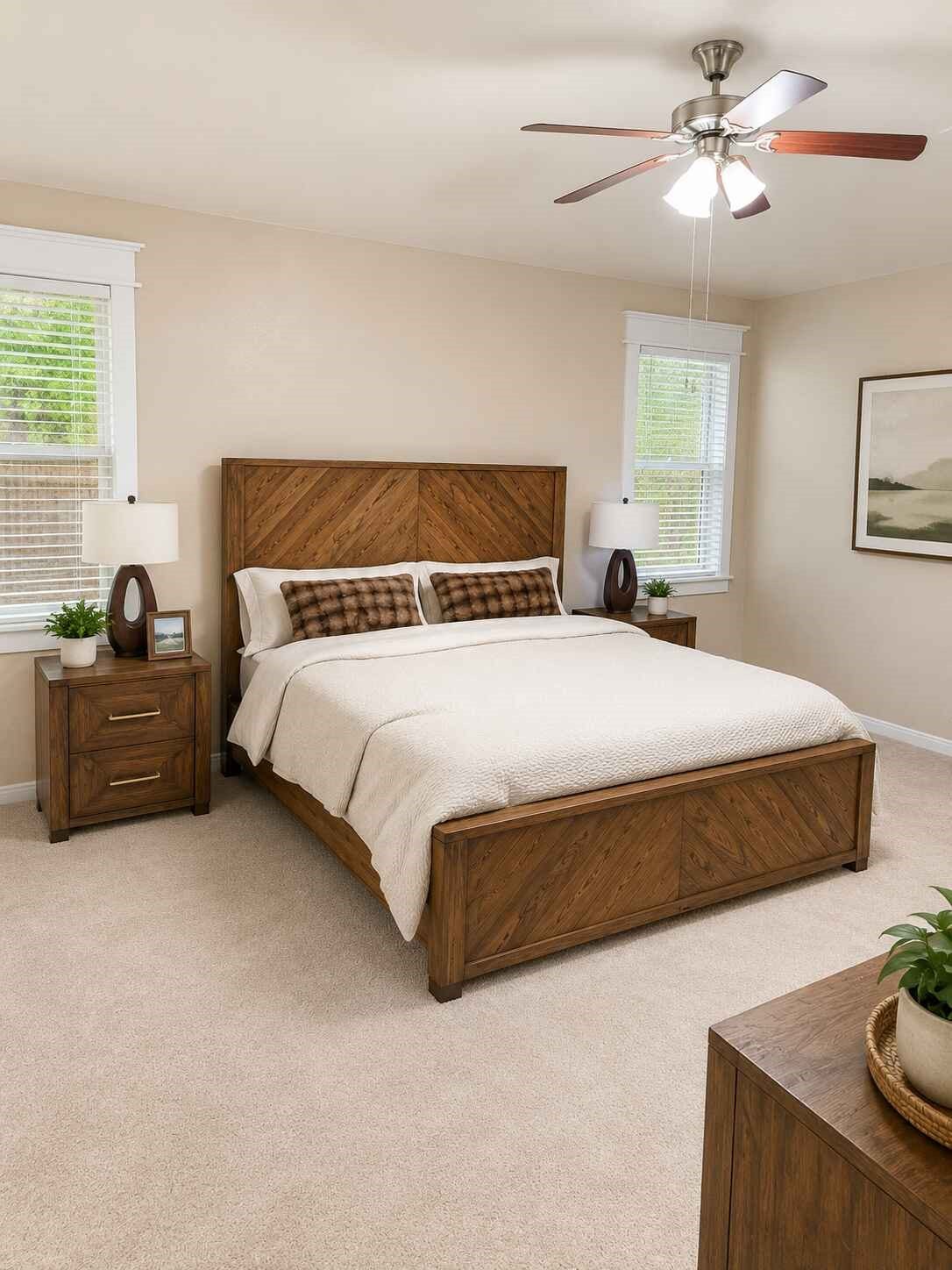 21570 Spear Valley Lane, Porter, TX 77365 Spacious primary bedroom offers plenty of room to unwind, with multiple windows providing natural light and a ceiling fan for added comfort