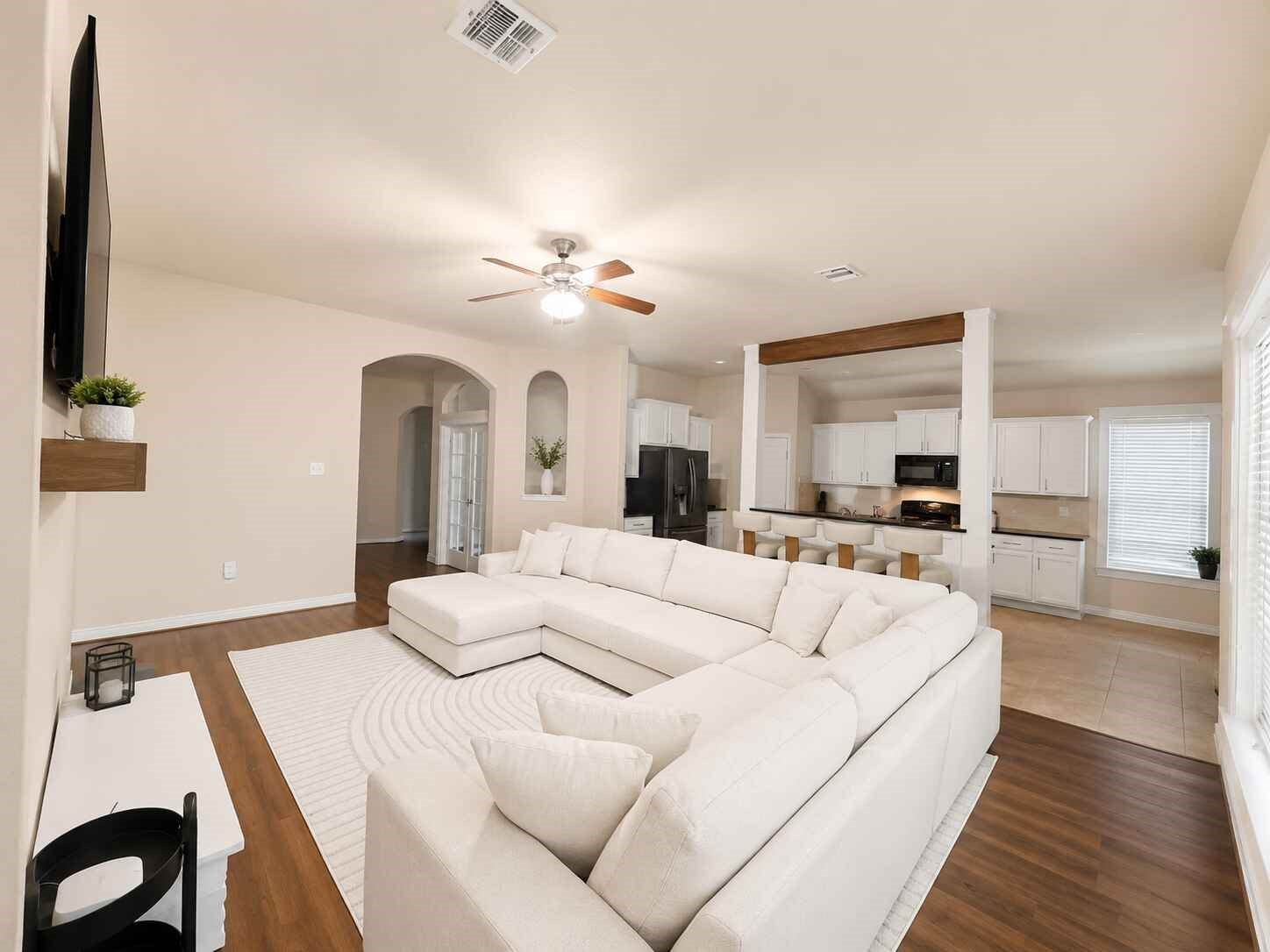 21570 Spear Valley Lane, Porter, TX 77365 Spacious open-concept living area flows seamlessly into the kitchen and breakfast space, creating a bright, comfortable setting with plenty of room to gather, entertain and enjoy everyday life