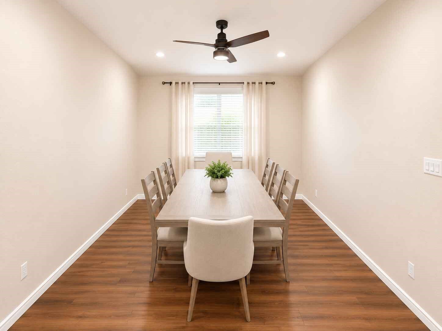 21570 Spear Valley Lane, Porter, TX 77365 Spacious formal dining room with warm wood-look flooring, recessed lighting and a modern ceiling fanplenty of room for everyday meals, holidays and gatherings with family and friends
