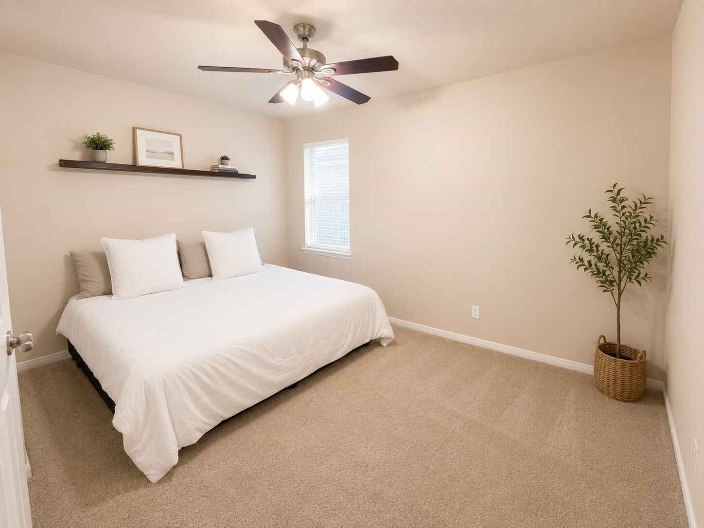 21570 Spear Valley Lane, Porter, TX 77365 Generously sized secondary bedroom offers plenty of space for a full bedroom setup, with soft neutral finishes, natural light and a ceiling fan for added comfort