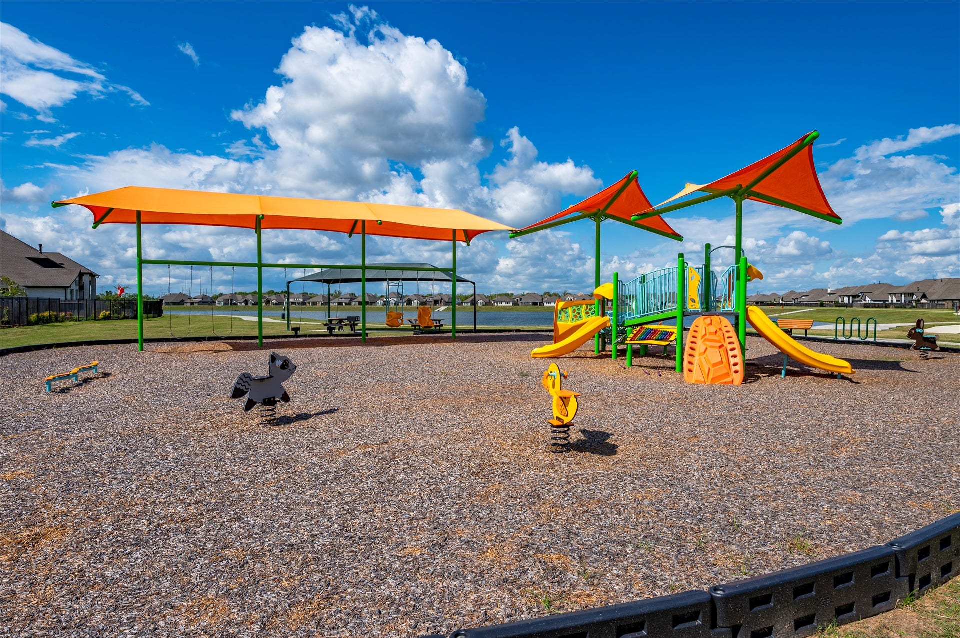 815 Wormwood Drive, League City, TX 77573 smaller of the two playgrounds surrounding the lake less than a 5-minute walk!
